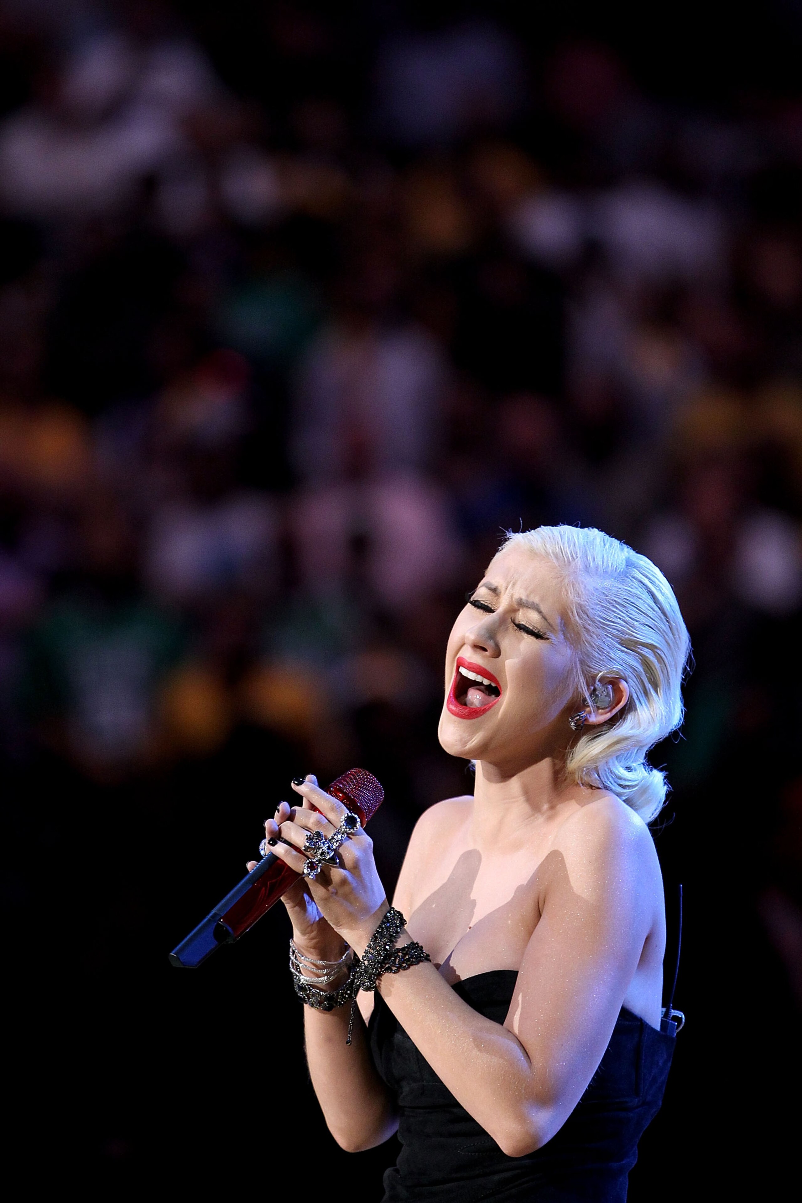 LOS ANGELES, CA - JUNE 15:  Singer Christina Aguilera sings the national anthem before Game Six of the 2010 NBA Finals between the Los Angeles Lakers and the Boston Celtics at Staples Center on June 15, 2010 in Los Angeles, California.  NOTE TO USER: User