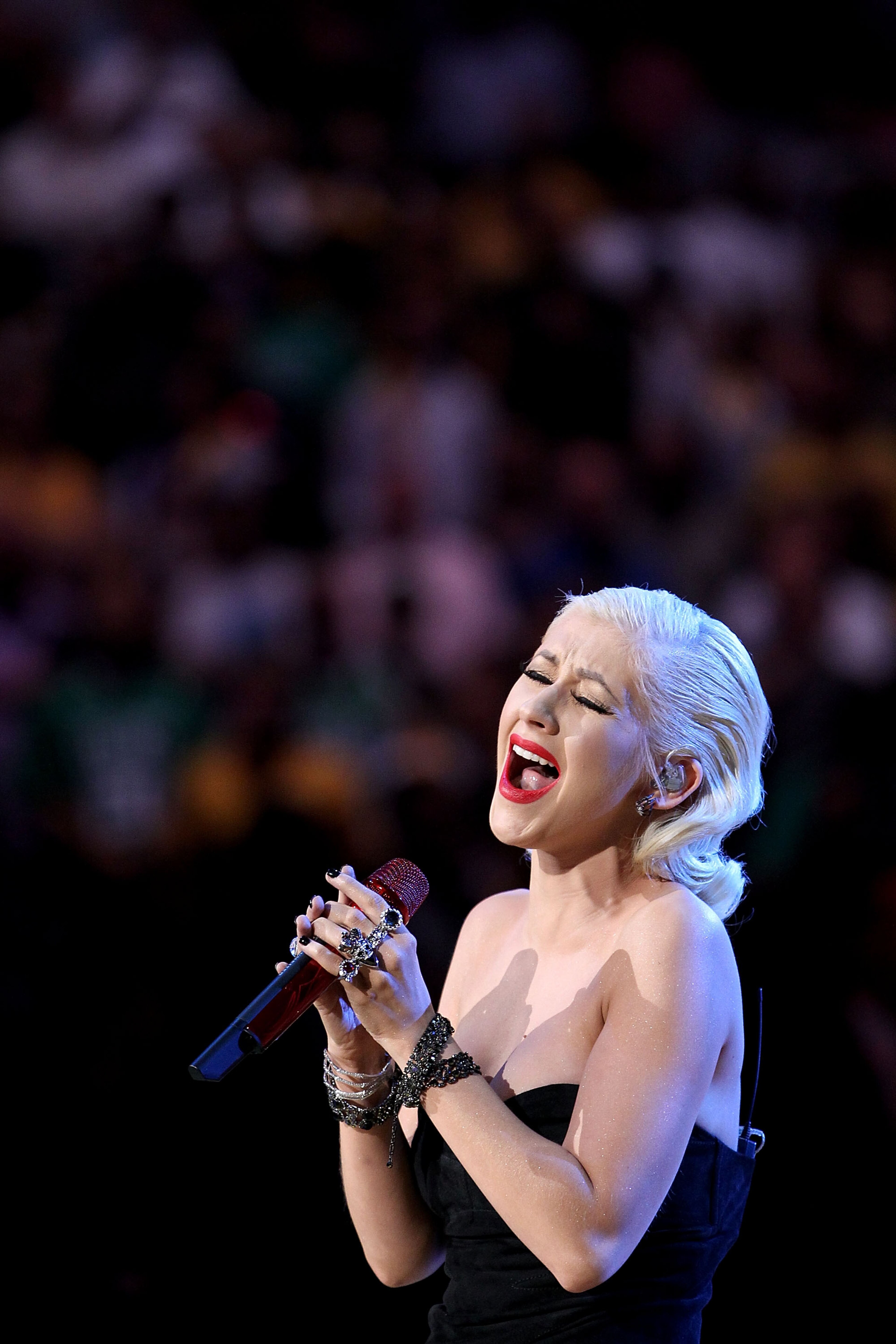 LOS ANGELES, CA - JUNE 15:  Singer Christina Aguilera sings the national anthem before Game Six of the 2010 NBA Finals between the Los Angeles Lakers and the Boston Celtics at Staples Center on June 15, 2010 in Los Angeles, California.  NOTE TO USER: User