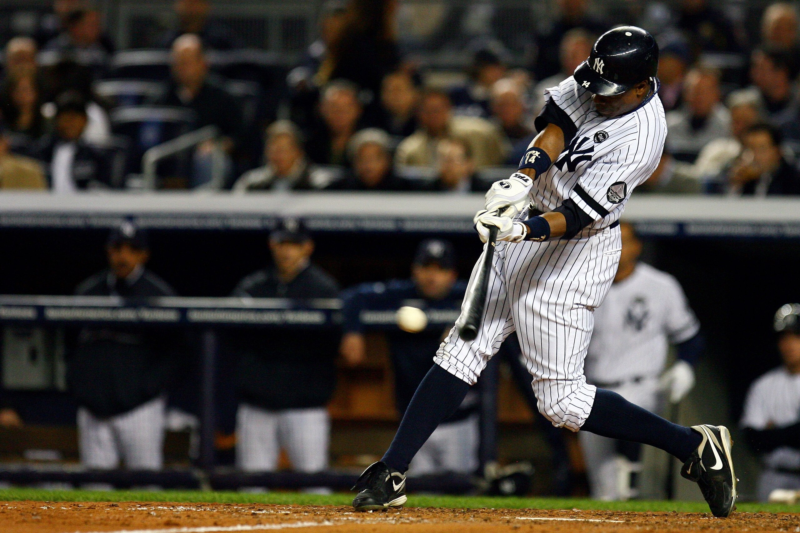 NEW YORK - OCTOBER 19:  Curtis Granderson #14 of the New York Yankees hits an RBI single in the third inning against the Texas Rangers in Game Four of the ALCS during the 2010 MLB Playoffs at Yankee Stadium on October 19, 2010 in the Bronx borough of New