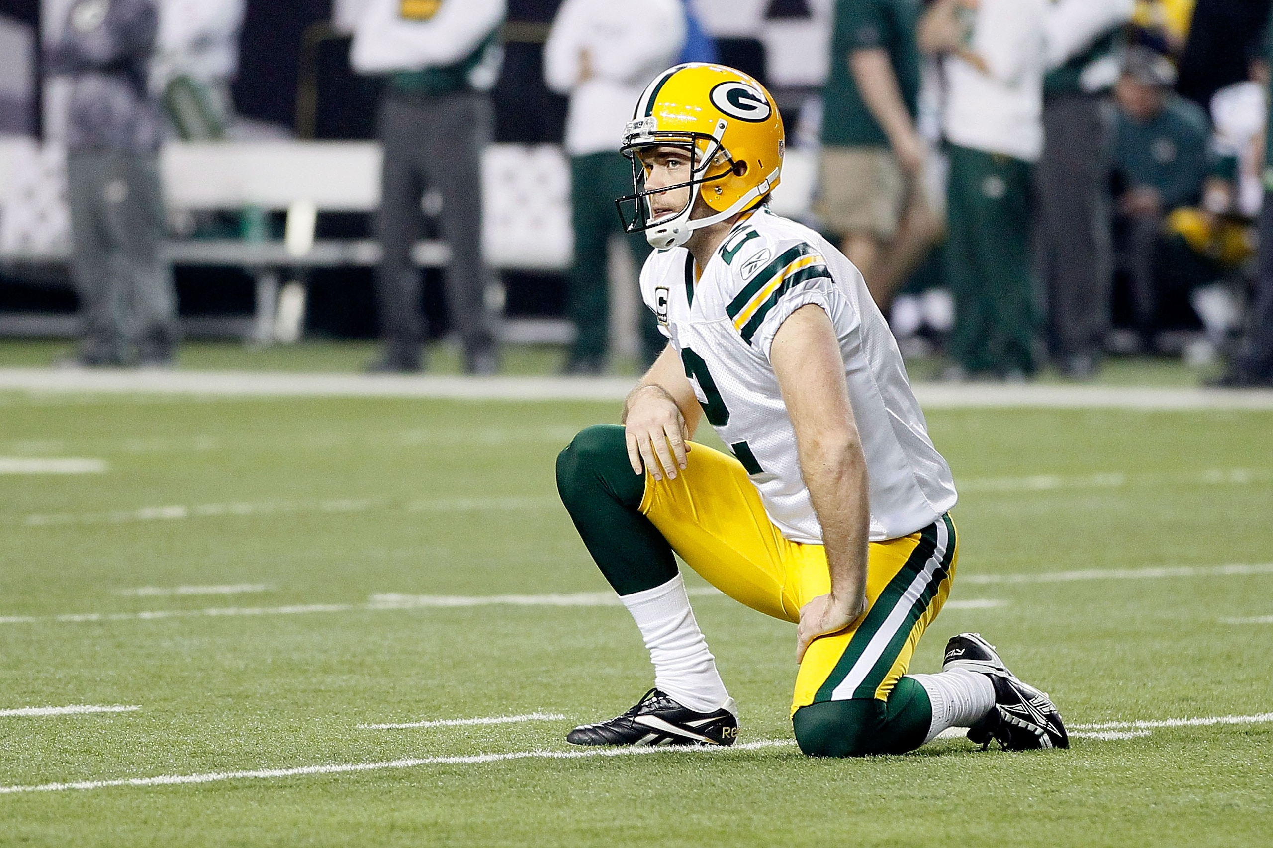 ATLANTA, GA - JANUARY 15: Kicker Mason Crosby #2 of the Green Bay Packers reacts after Eric Weems #14 of the Atlanta Falcons scored a 10-yard kickoff return for a touchdown in the seocnd quarter during their 2011 NFC divisional playoff game at Georgia Do ATLANTA, GA - JANUARY 15: Kicker Mason Crosby #2 of the Green Bay Packers reacts after Eric Weems #14 of the Atlanta Falcons scored a 10-yard kickoff return for a touchdown in the seocnd quarter during their 2011 NFC divisional playoff game at Georgia Do