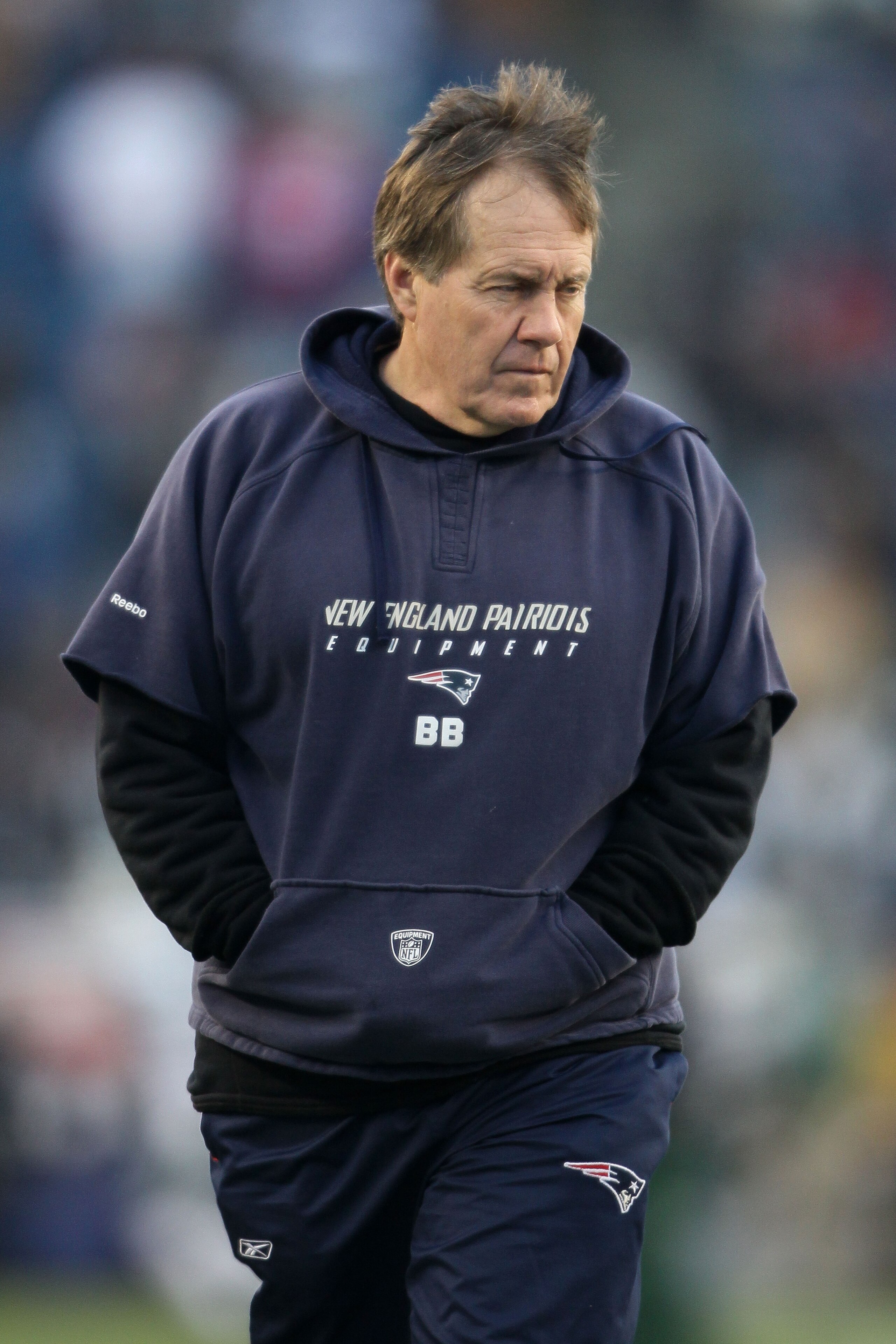 FOXBORO, MA - JANUARY 16: Head coach Bill Belichick of the New England Patriots stands on the field during their 2011 AFC divisional playoff game against the New York Jets at Gillette Stadium on January 16, 2011 in Foxboro, Massachusetts. (Photo by Elsa FOXBORO, MA - JANUARY 16: Head coach Bill Belichick of the New England Patriots stands on the field during their 2011 AFC divisional playoff game against the New York Jets at Gillette Stadium on January 16, 2011 in Foxboro, Massachusetts. (Photo by Elsa