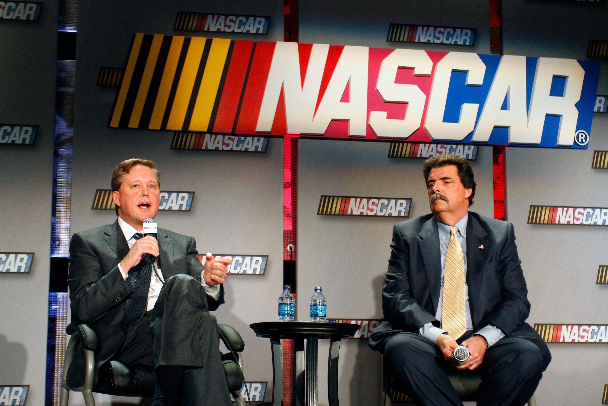 CHARLOTTE, NC - JANUARY 26:  NASCAR CEO and Chairman Brian France (L) and President Mike Helton, speak with the media during the NASCAR Sprint Media Tour hosted by Charlotte Motor Speedway, held at the NASCAR Hall of Fame on January 26, 2011 in Charlotte,