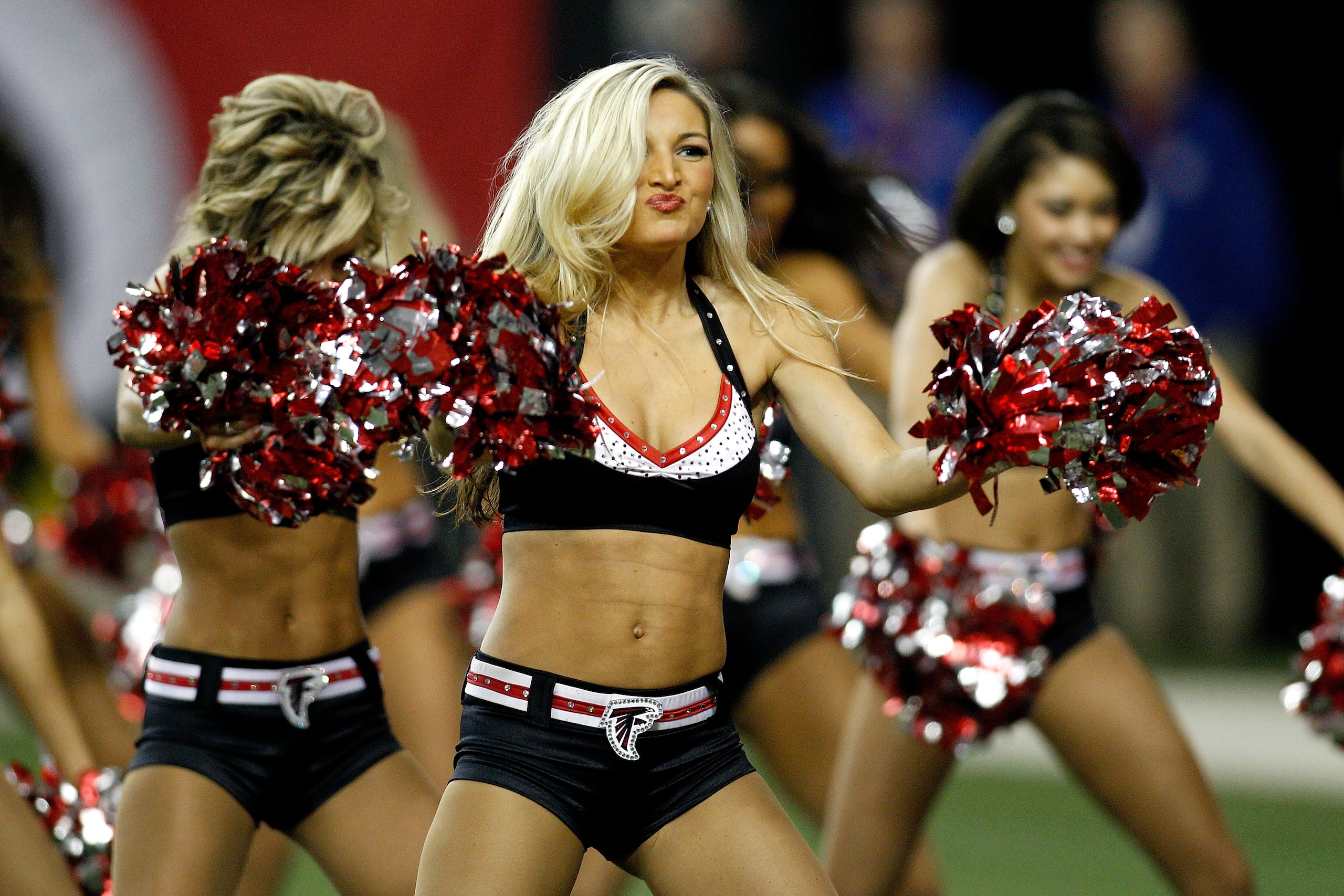 ATLANTA, GA - JANUARY 15:  Cheerleaders from the Atlanta Falcons perform against the Green Bay Packers during their 2011 NFC divisional playoff game at Georgia Dome on January 15, 2011 in Atlanta, Georgia. The Packers won 48-21. (Photo by Chris Graythen/G