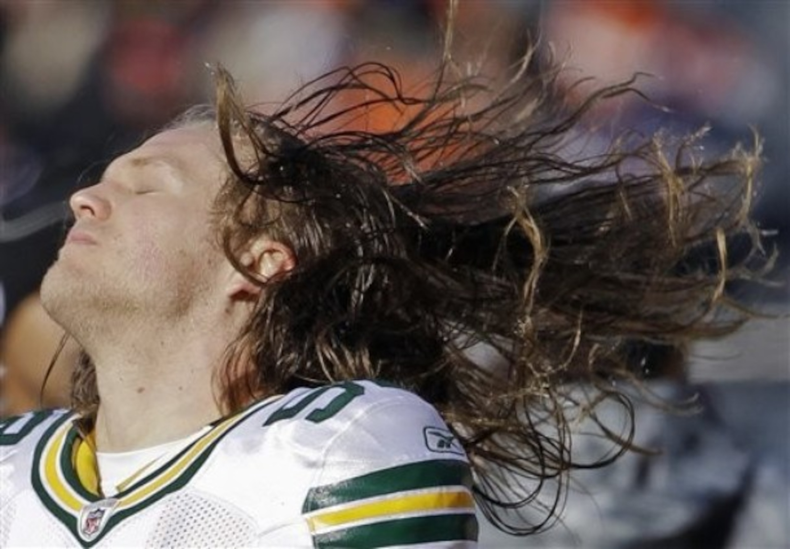 Clay Matthews whips his hair back and forth