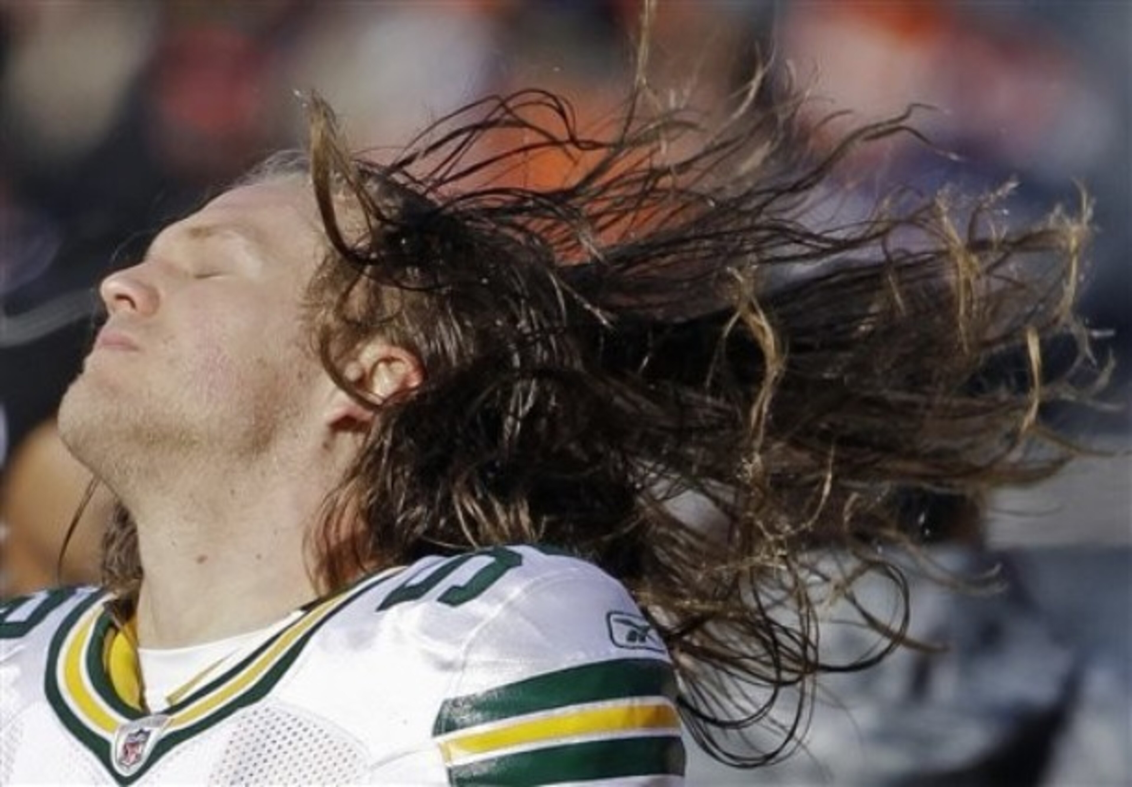 Clay Matthews whips his hair back and forth