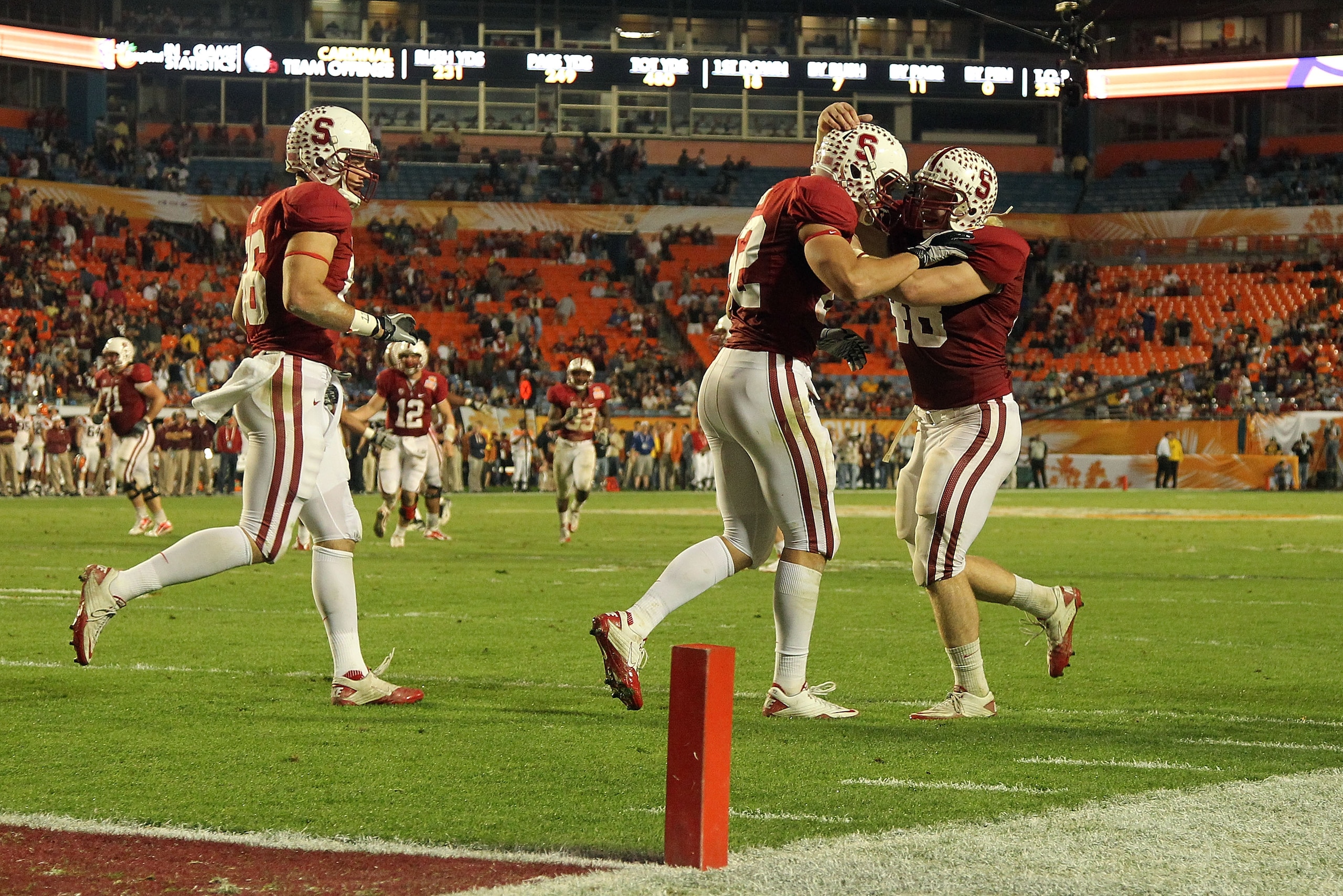 MIAMI, FL - JANUARY 03: Coby Fleener #82 (C) and Owen Marecic #48 (R) of the Stanford Cardinal celebrate after Fleener scored his 3rd touchdown of the game against the Virginia Tech Hokies during the 2011 Discover Orange Bowl at Sun Life Stadium on Januar