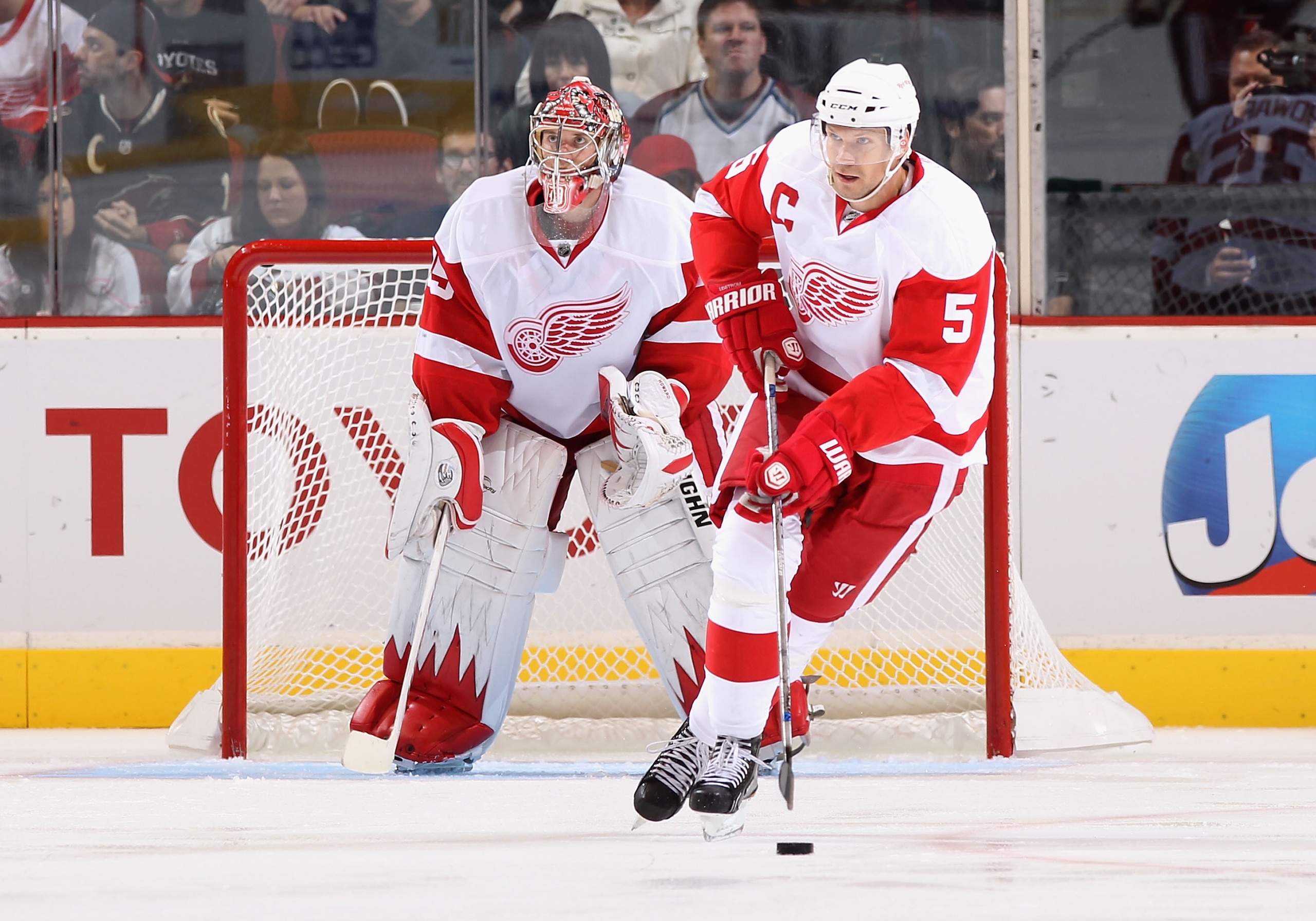 GLENDALE, AZ - OCTOBER 16:  Nicklas Lidstrom #5 of the Detroit Red Wings skates past goaltender Jimmy Howard #35 during the NHL game against the Phoenix Coyotes at Jobing.com Arena on October16, 2010 in Glendale, Arizona.  The Red Wings defeated the Coyot