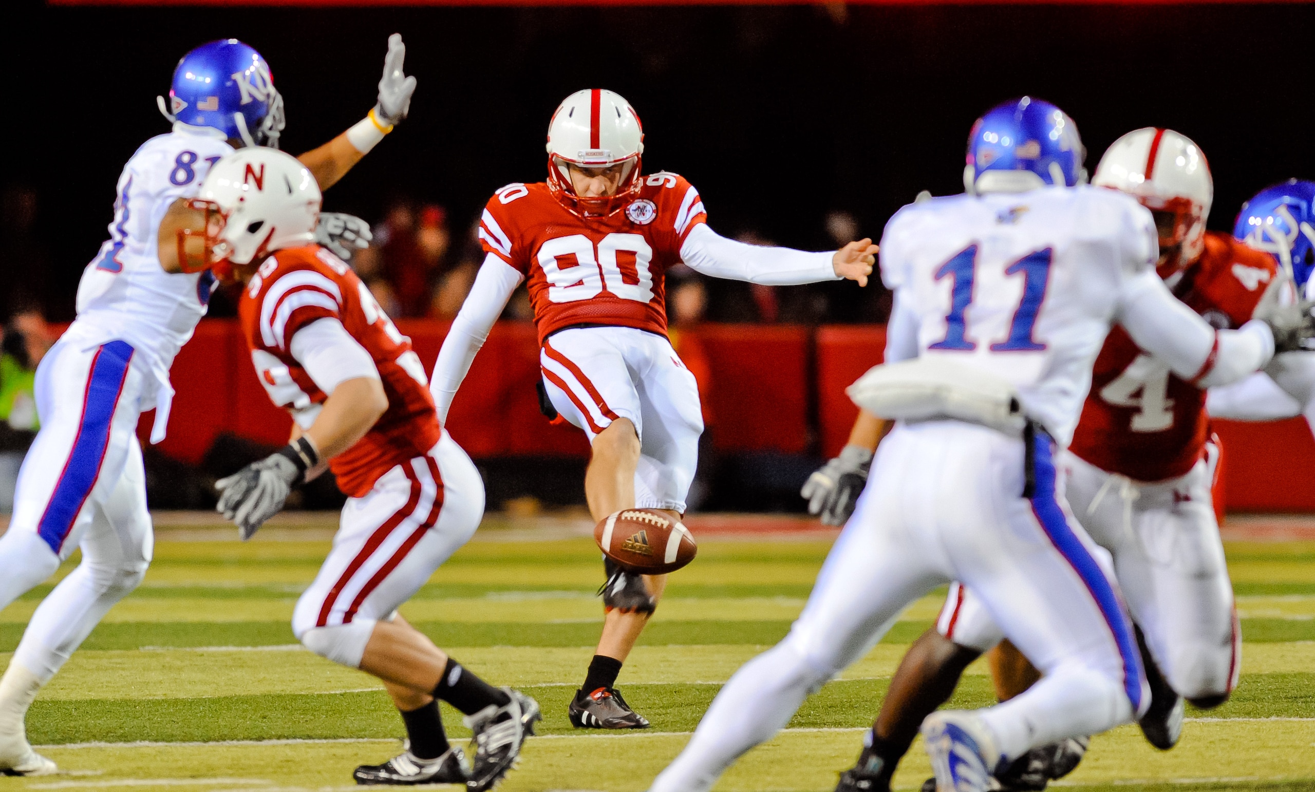 LINCOLN, NE - NOVEMBER 13: Alex Henery #90 of the Nebraska Cornhuskers punts the ball away during their game against the Kansas Jayhawks at Memorial Stadium on November 13, 2010 in Lincoln, Nebraska. Nebraska Defeated Kansas 20-3. (Photo by Eric Francis/G