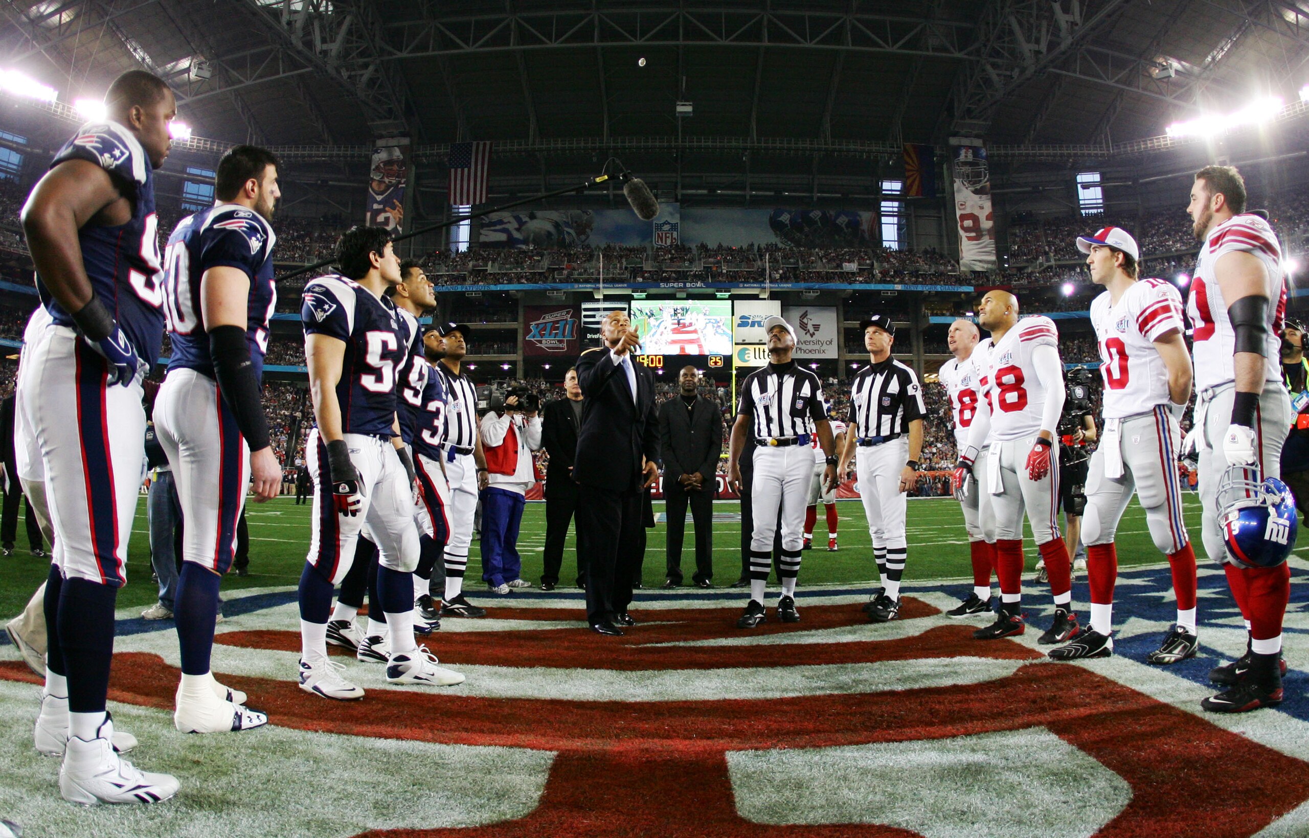 GLENDALE, AZ - FEBRUARY 03:  Hall of Famer Ronnie Lott performs the coin toss before the New York Giants take on the New England Patriots during Super Bowl XLII on February 3, 2008 at the University of Phoenix Stadium in Glendale, Arizona.  (Photo by Harr