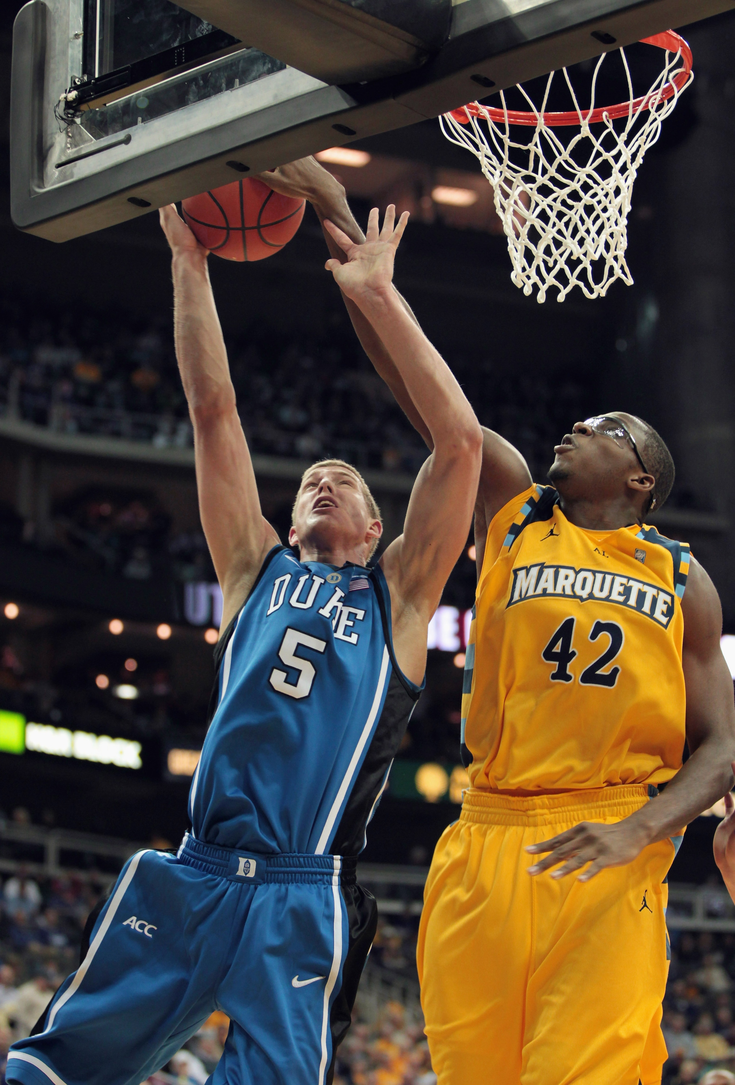 KANSAS CITY, MO - NOVEMBER 22:  Chris Otule #42 of the Marquette Golden Eagles blocks a shot by Mason Plumlee #5 of the Duke Blue Devils during the CBE Classic game on November 22, 2010 at the Sprint Center in Kansas City, Missouri.  (Photo by Jamie Squir