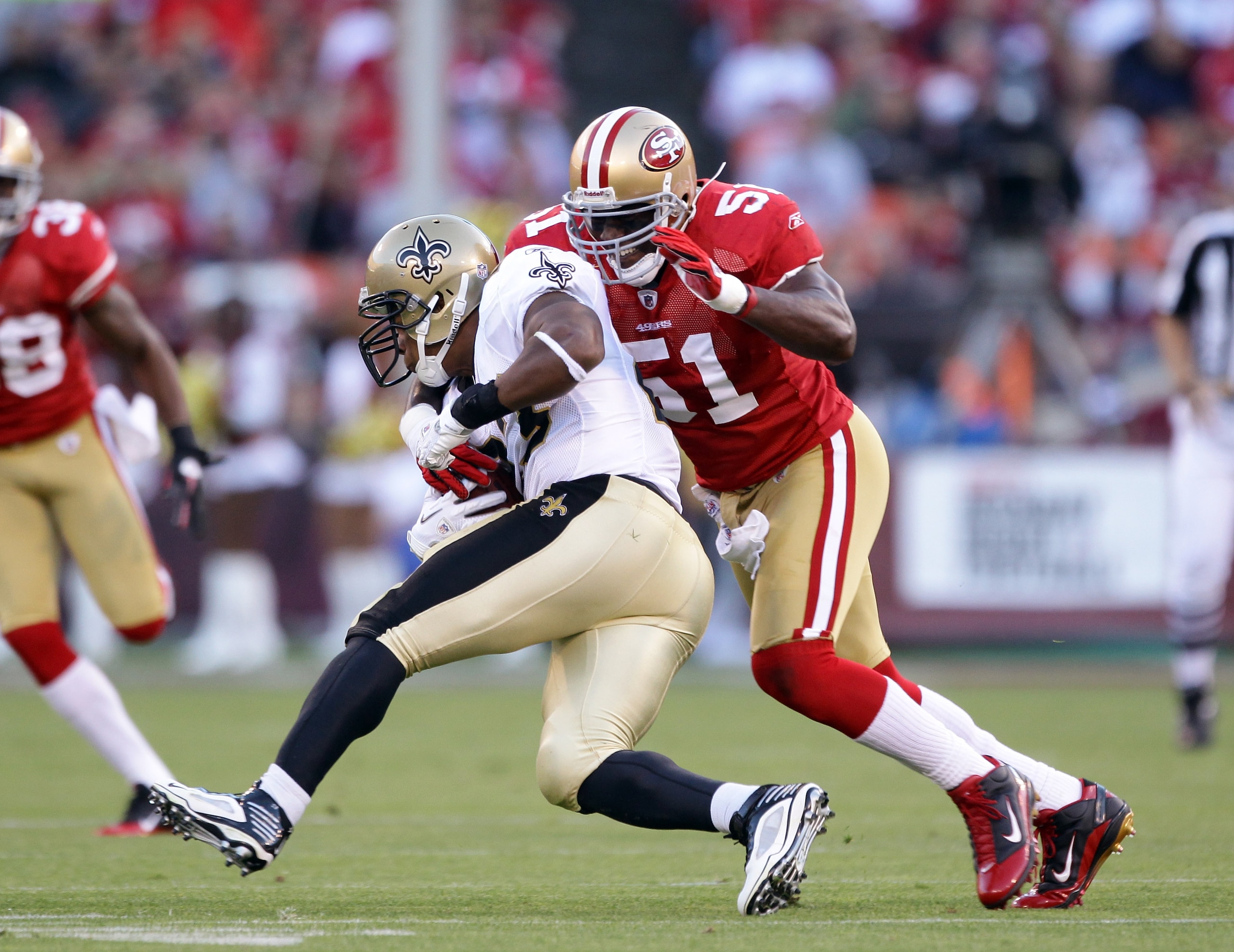SAN FRANCISCO - SEPTEMBER 20:  Pierre Thomas #23 of the New Orleans Saints is tackled by Takeo Spikes #51 of the San Francisco 49ers at Candlestick Park on September 20, 2010 in San Francisco, California.  (Photo by Ezra Shaw/Getty Images)