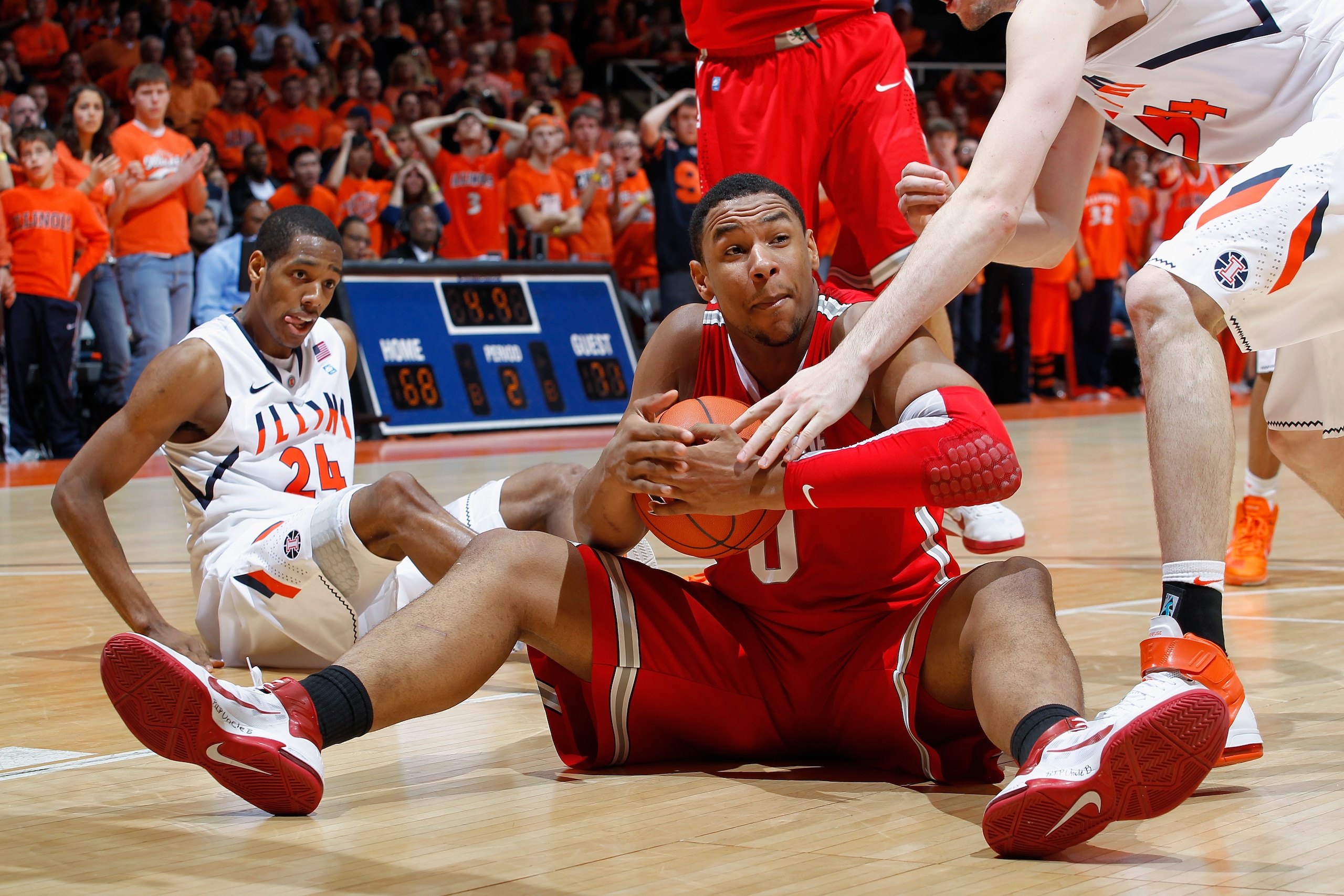 CHAMPAIGN, IL - JANUARY 22: Jared Sullinger #0 of the Ohio State Buckeyes signals for a timeout after stealing the ball late in the game against the Illinois Fighting Illini at Assembly Hall on January 22, 2011 in Champaign, Illinois. Ohio State won 73-68