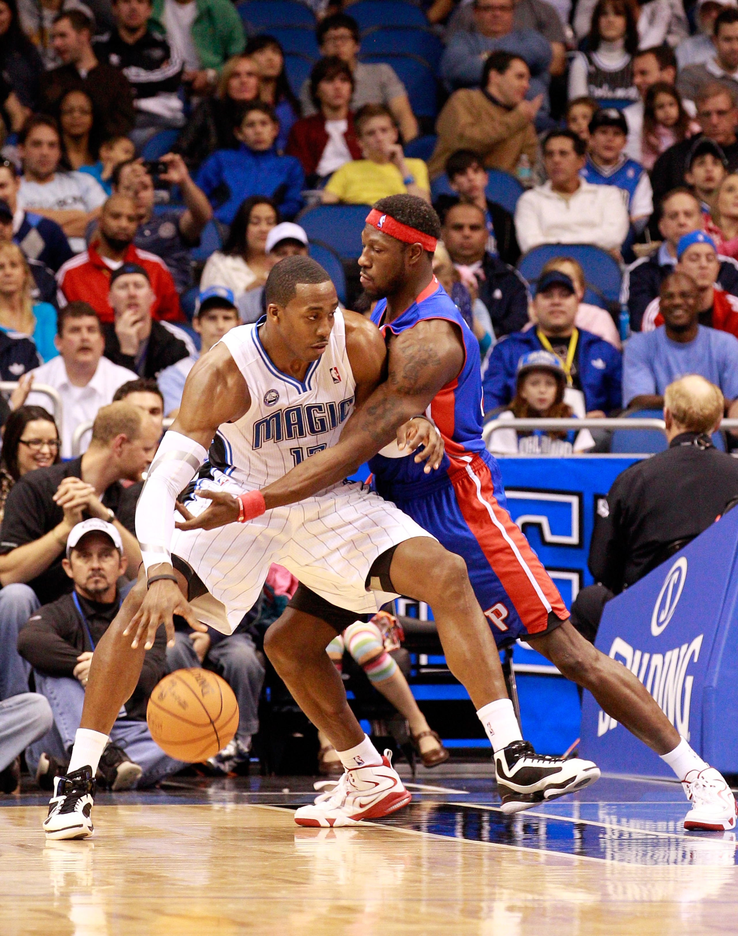 ORLANDO, FL - JANUARY 24:  Ben Wallace #6 of the Detroit Pistons guards Dwight Howard #12 of the Orlando Magic during the game at Amway Arena on January 24, 2011 in Orlando, Florida.  NOTE TO USER: User expressly acknowledges and agrees that, by downloadi