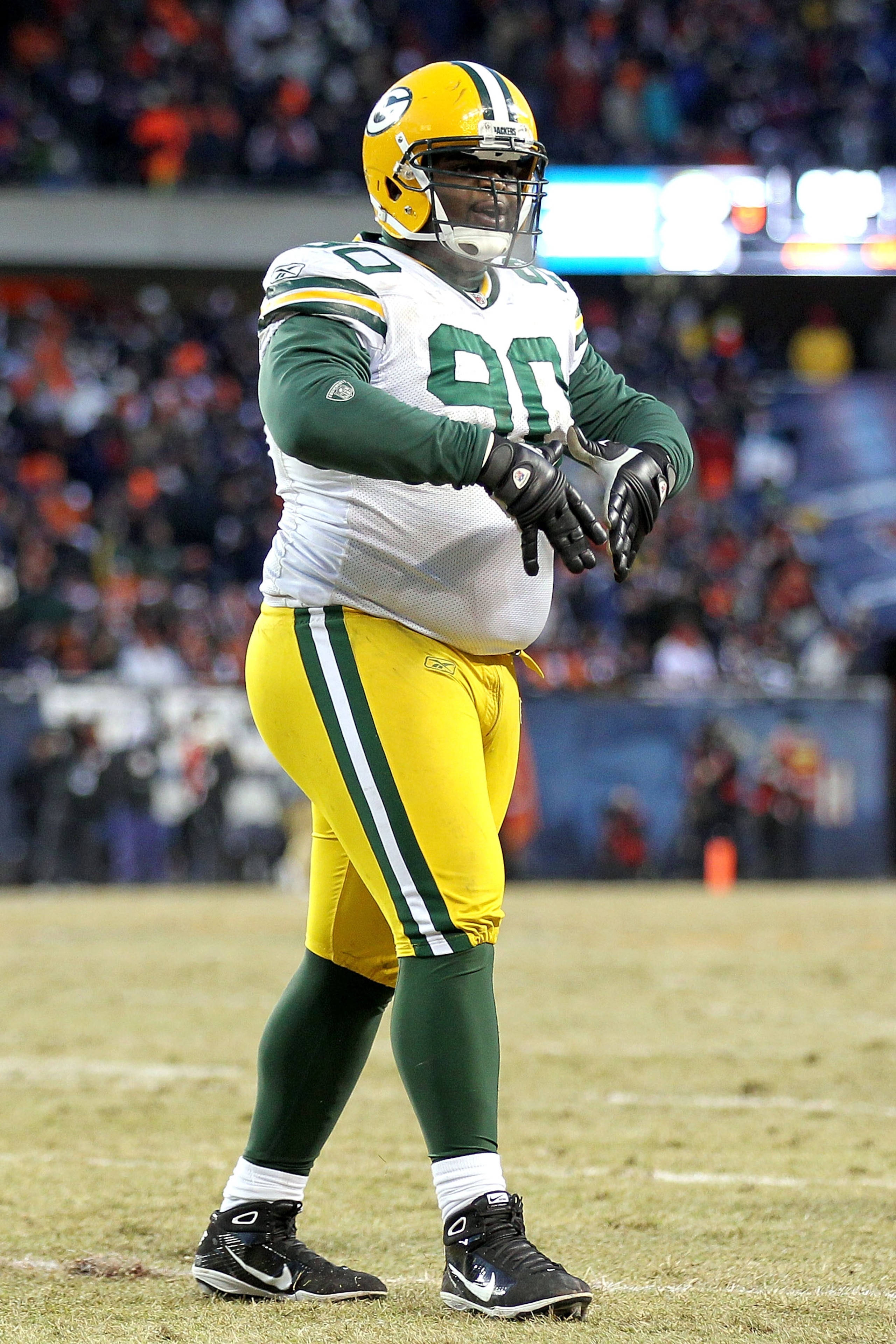 CHICAGO, IL - JANUARY 23: B.J. Raji #90 of the Green Bay Packers reacts after scoring on a 18-yard interception return for a touchdown in the fourth quarter against the Chicago Bears in the NFC Championship Game at Soldier Field on January 23, 2011 in Ch CHICAGO, IL - JANUARY 23: B.J. Raji #90 of the Green Bay Packers reacts after scoring on a 18-yard interception return for a touchdown in the fourth quarter against the Chicago Bears in the NFC Championship Game at Soldier Field on January 23, 2011 in Ch