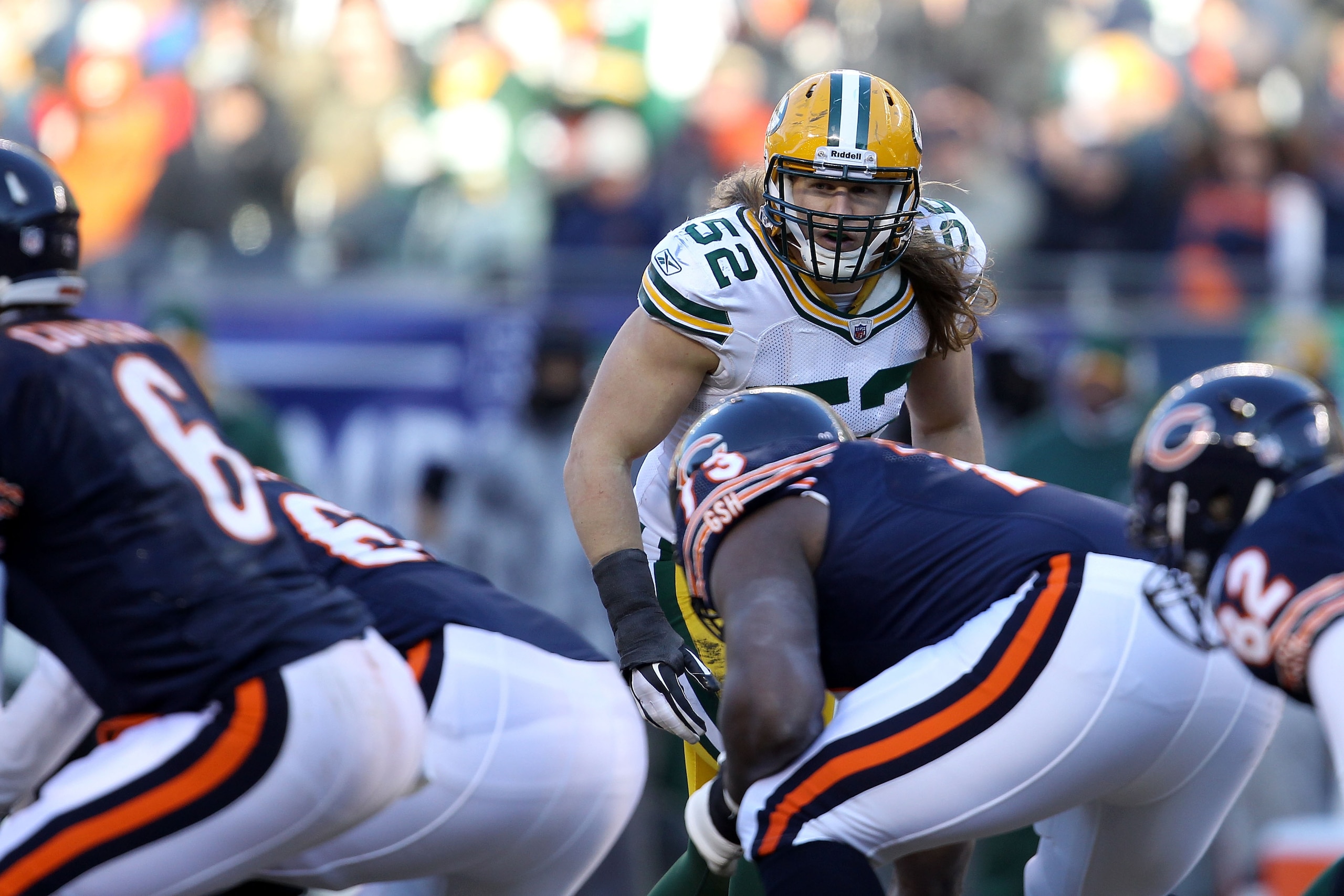 CHICAGO, IL - JANUARY 23:  Linebacker Clay Matthews #52 of the Green Bay Packers looks down the line over at quarterback Jay Cutler #6 of the Chicago Bears in the NFC Championship Game at Soldier Field on January 23, 2011 in Chicago, Illinois.  (Photo by