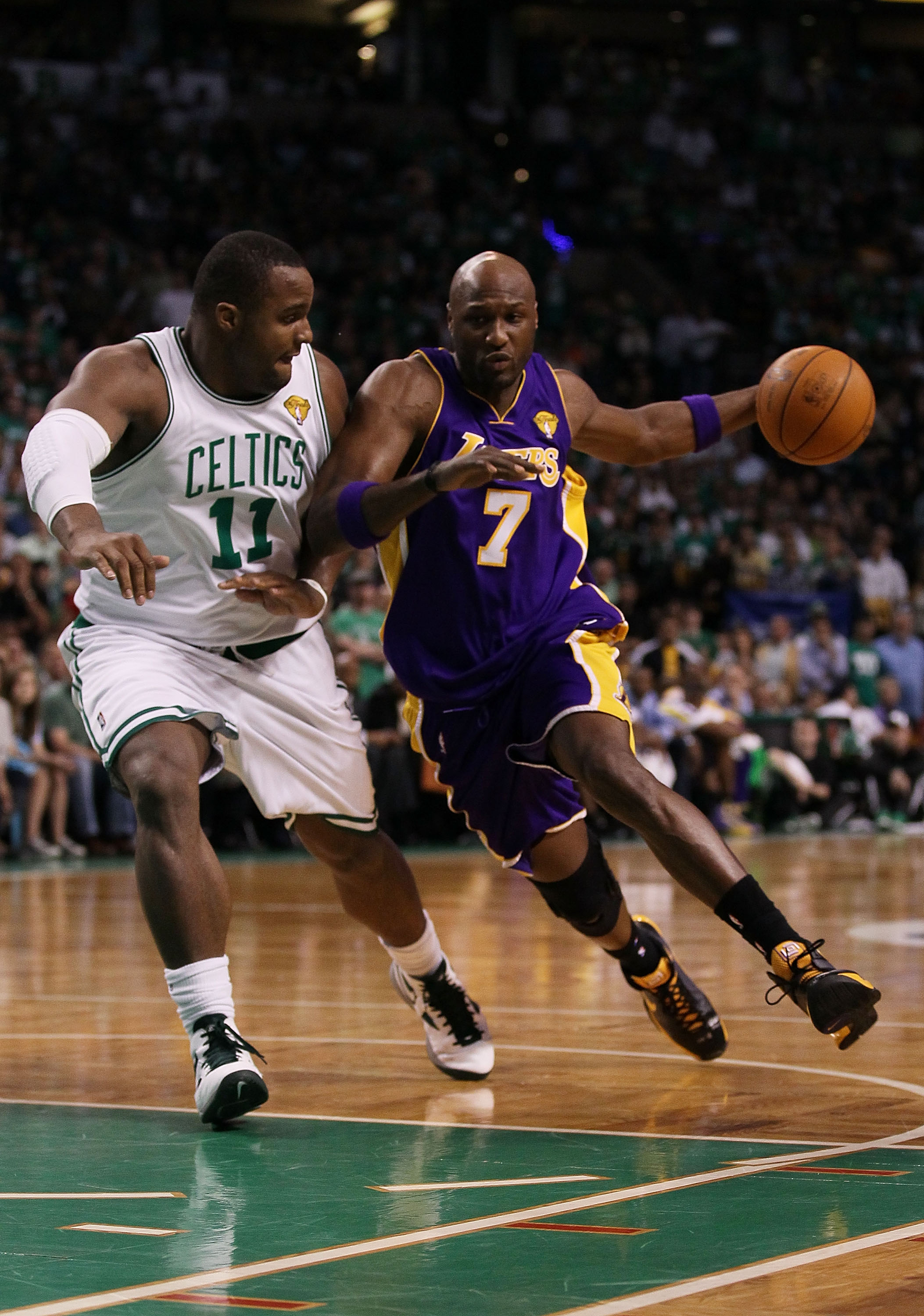 BOSTON - JUNE 13:  Lamar Odom #7 of the Los Angeles Lakers drives to the basket against Glen Davis #11 of the Boston Celtics during Game Five of the 2010 NBA Finals on June 13, 2010 at TD Garden in Boston, Massachusetts. NOTE TO USER: User expressly ackno
