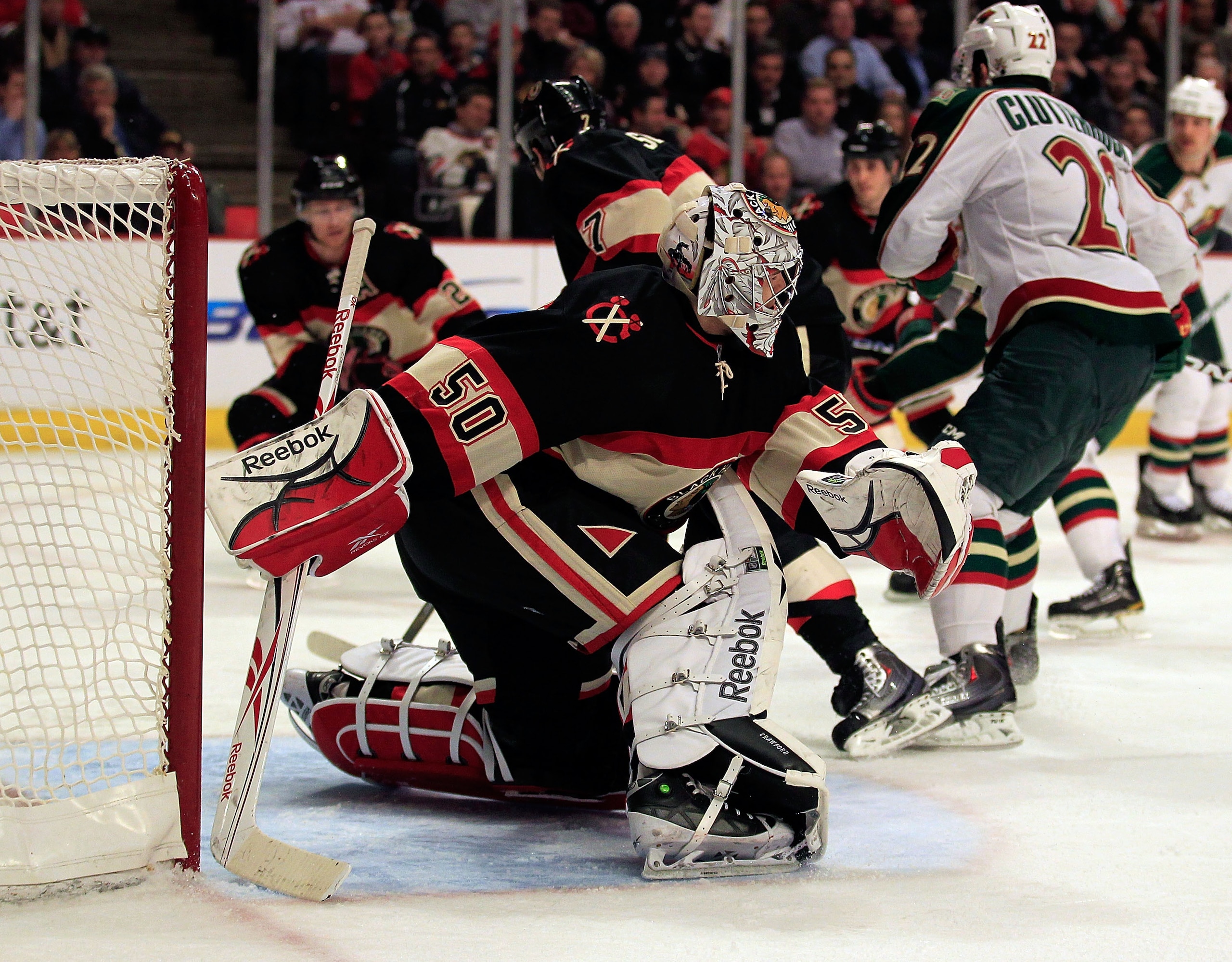 CHICAGO, IL - JANUARY 25: Corey Crawford #50 of the Chicago Blackhawks follows the puck against the Minnesota Wild at the United Center on January 25, 2011 in Chicago, Illinois. The Wild defeated the Blackhawks 4-2. (Photo by Jonathan Daniel/Getty Images)