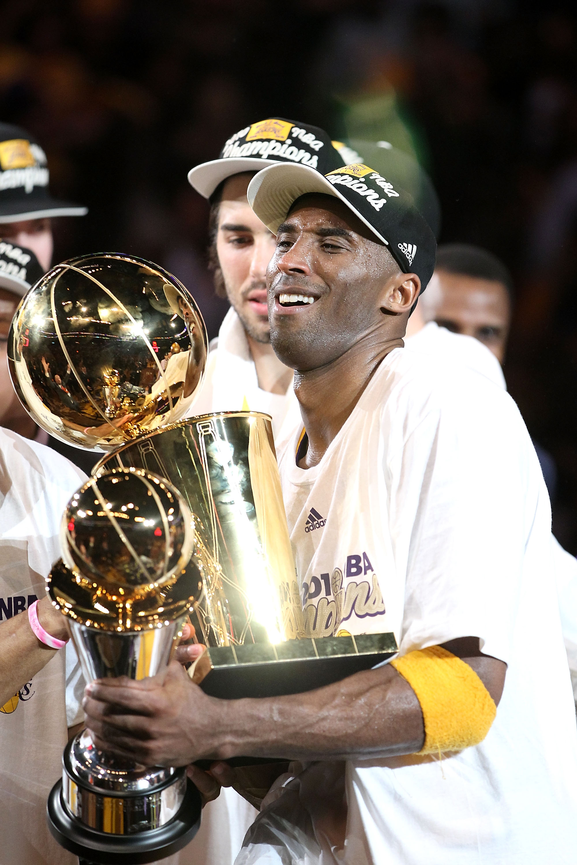 LOS ANGELES, CA - JUNE 17:  Kobe Bryant #24 of the Los Angeles Lakers struggles to hold both the Larry O'Brien trophy and the MVP trophy after the Lakers defeated the Boston Celtics in Game Seven of the 2010 NBA Finals at Staples Center on June 17, 2010 i