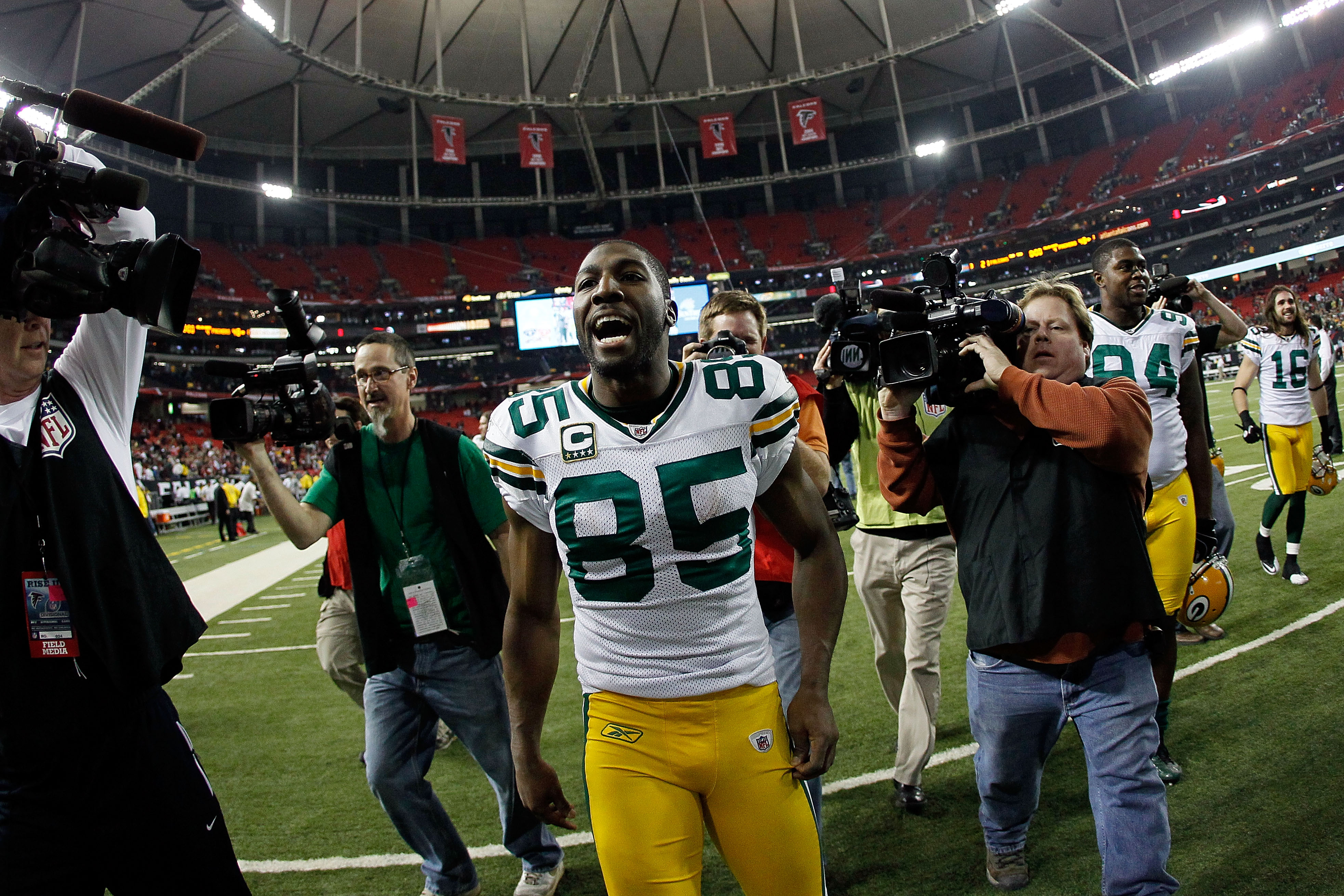 ATLANTA, GA - JANUARY 15:  Greg Jennings #85 of the Green Bay Packers celebrates as he walks off the field after the Packers own 48-21 against the Atlanta Falcons during their 2011 NFC divisional playoff game at Georgia Dome on January 15, 2011 in Atlanta