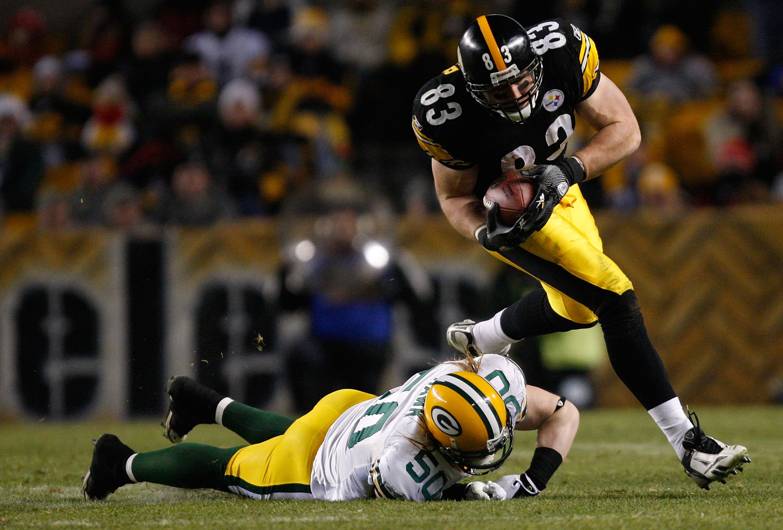 PITTSBURGH - DECEMBER 20: Heath Miller #83 of the Pittsburgh Steelers attempts to break through a tackle by AJ Hawk #50 of the Green Bay Packers during the game on December 20, 2009 at Heinz Field in Pittsburgh, Pennsylvania. (Photo by Jared Wickerham/Get