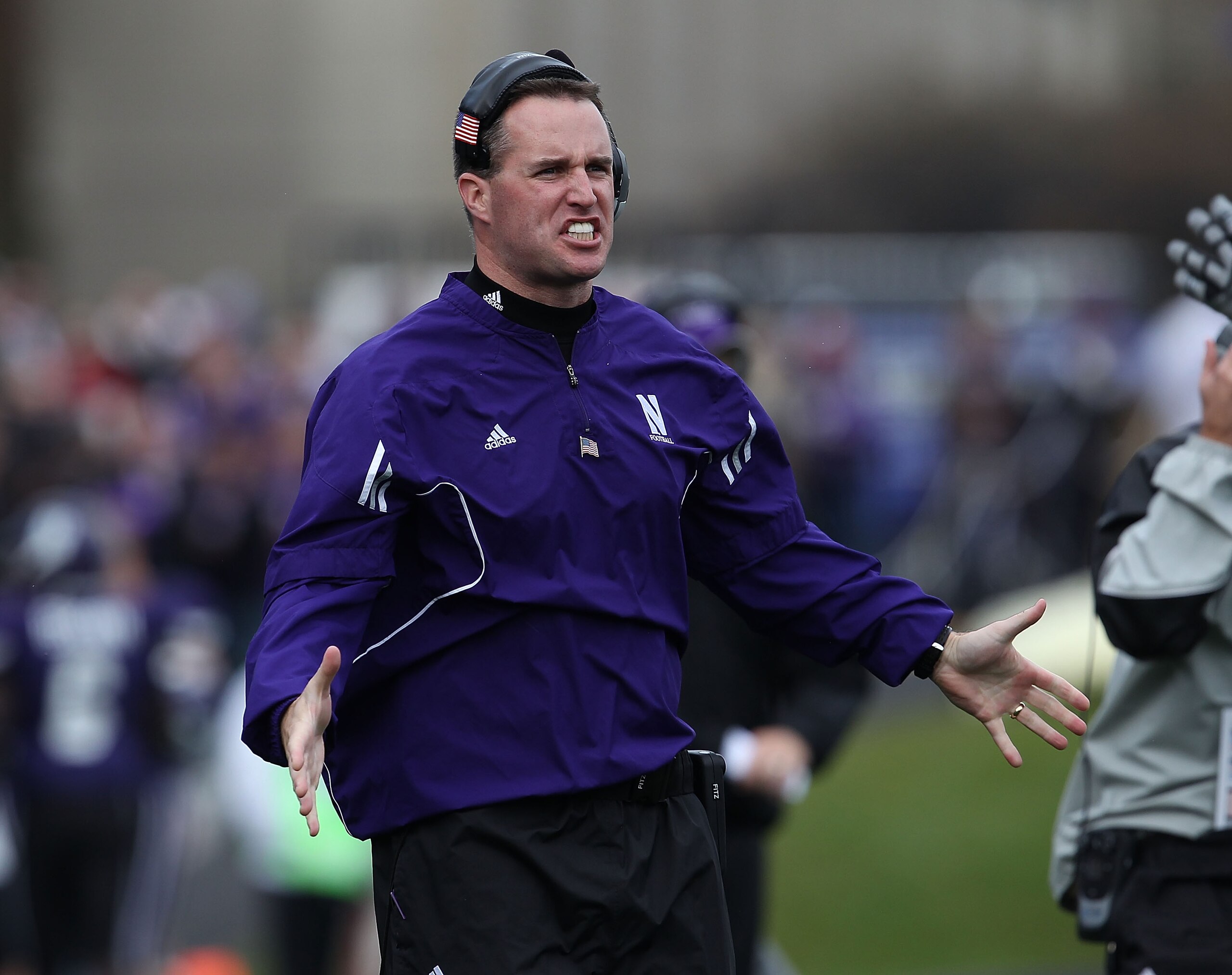 EVANSTON, IL - OCTOBER 23: Head coach Pat Fitzgerald of the Northwestern Wildcats encourages his team takes on the Michigan State Spartans at Ryan Field on October 23, 2010 in Evanston, Illinois. Michigan State defeated Northwestern 35-27. (Photo by Jona EVANSTON, IL - OCTOBER 23: Head coach Pat Fitzgerald of the Northwestern Wildcats encourages his team takes on the Michigan State Spartans at Ryan Field on October 23, 2010 in Evanston, Illinois. Michigan State defeated Northwestern 35-27. (Photo by Jona