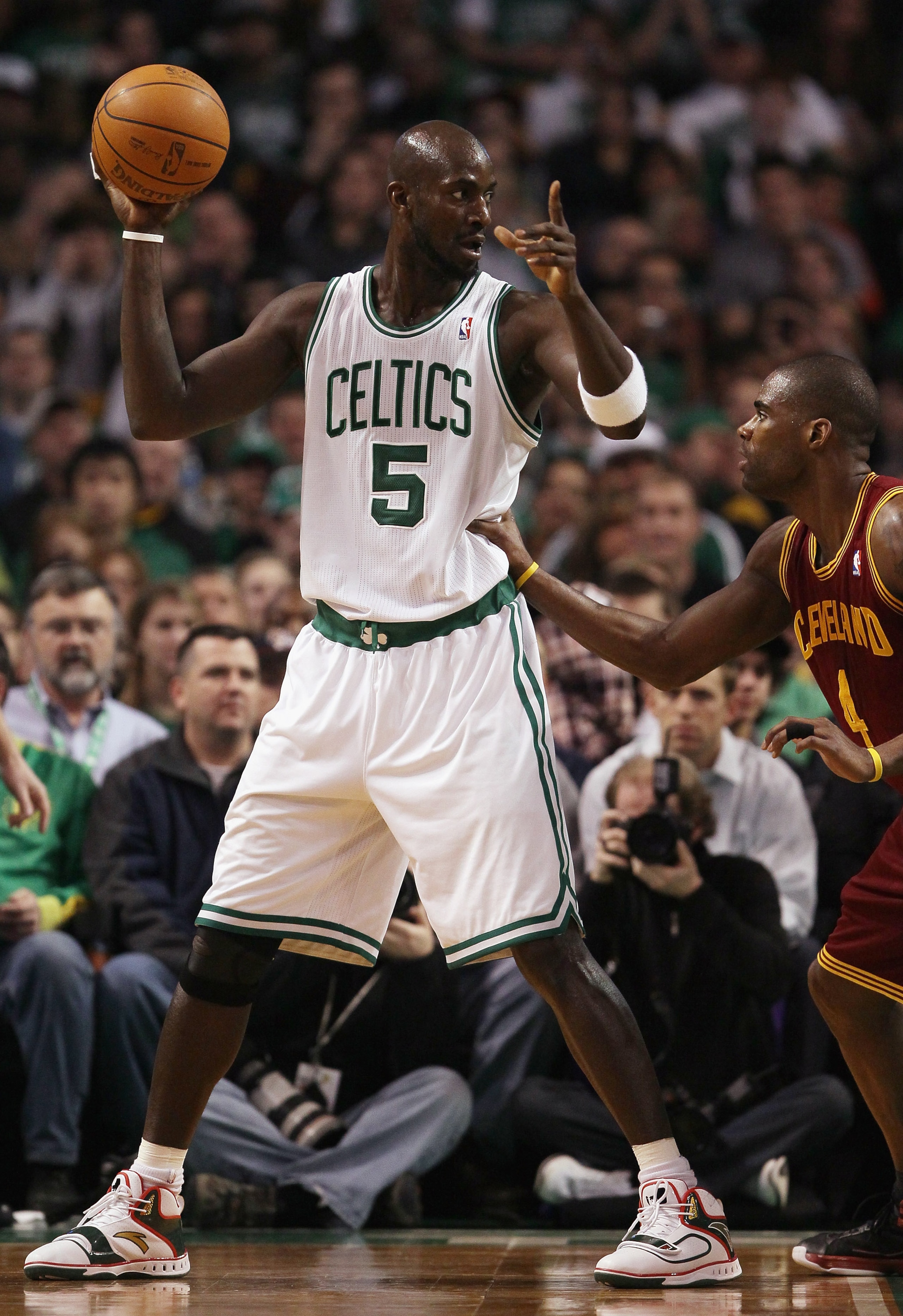 BOSTON, MA - JANUARY 25: Kevin Garnett #5 of the Boston Celtics directs his teammates as Antawn Jamison #4 of the Cleveland Cavaliers defends on January 25, 2011 at the TD Garden in Boston, Massachusetts. NOTE TO USER: User expressly acknowledges and a BOSTON, MA - JANUARY 25: Kevin Garnett #5 of the Boston Celtics directs his teammates as Antawn Jamison #4 of the Cleveland Cavaliers defends on January 25, 2011 at the TD Garden in Boston, Massachusetts. NOTE TO USER: User expressly acknowledges and a