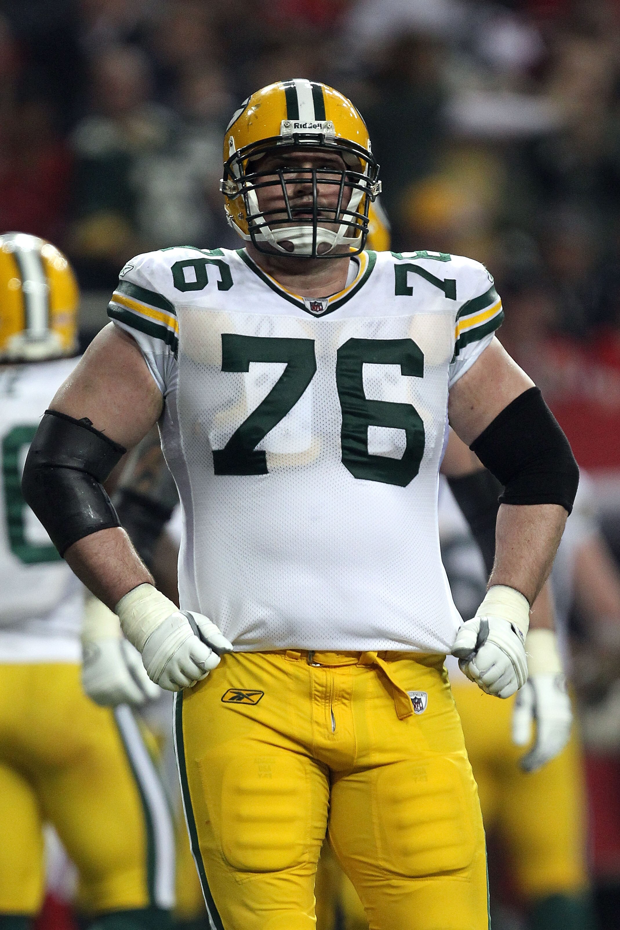 ATLANTA, GA - JANUARY 15:  Chad Clifton #76 of the Green Bay Packers looks on against the Atlanta Falcons during their 2011 NFC divisional playoff game at Georgia Dome on January 15, 2011 in Atlanta, Georgia. The Packers won 48-21.  (Photo by Streeter Lec