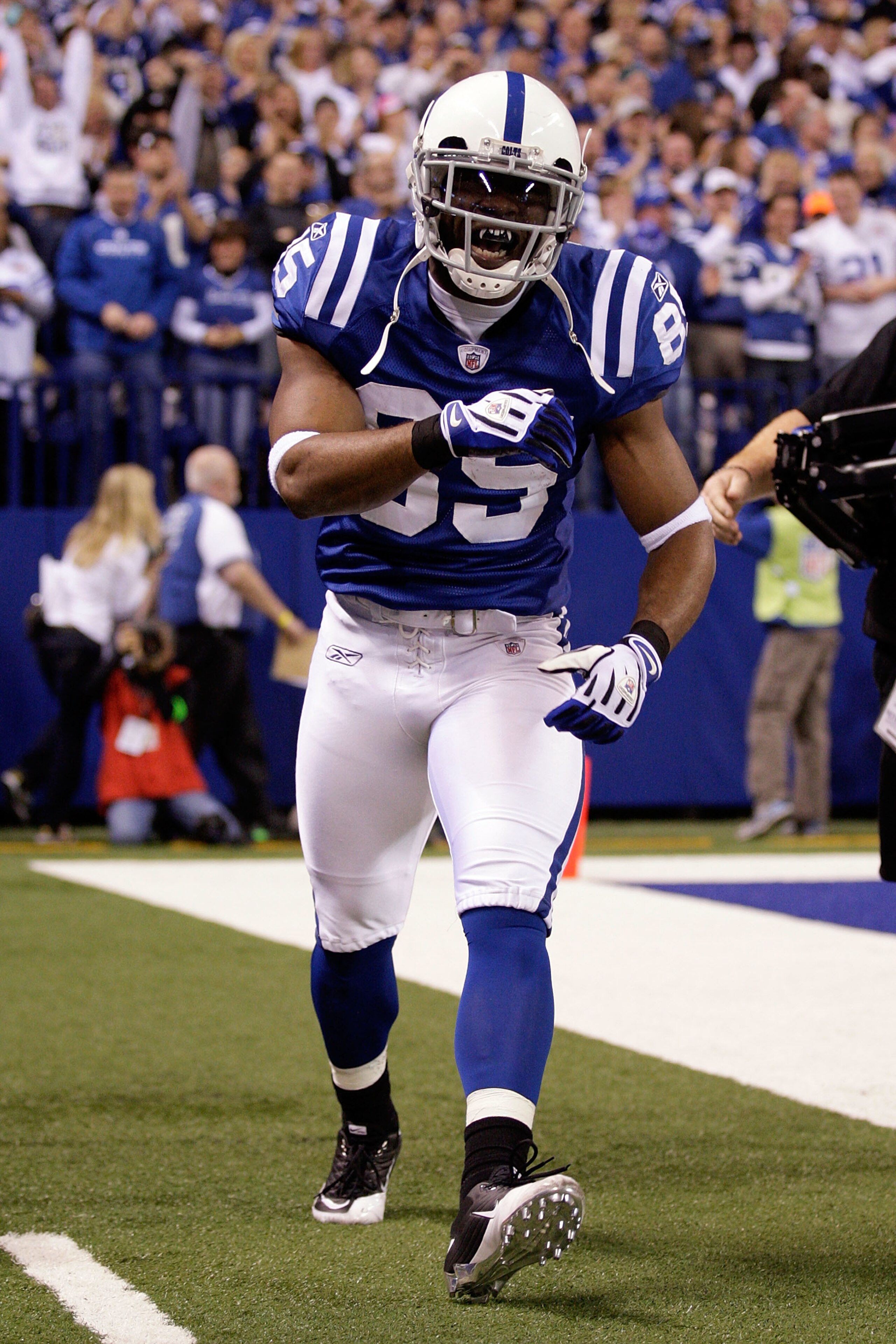 INDIANAPOLIS, IN - JANUARY 08:  Pierre Garcon #85 of the Indianapolis Colts celebrates after he scored on a 57-yard touchdown reception in the seocnd quarter against the New York Jets during their 2011 AFC wild card playoff game at Lucas Oil Stadium on Ja