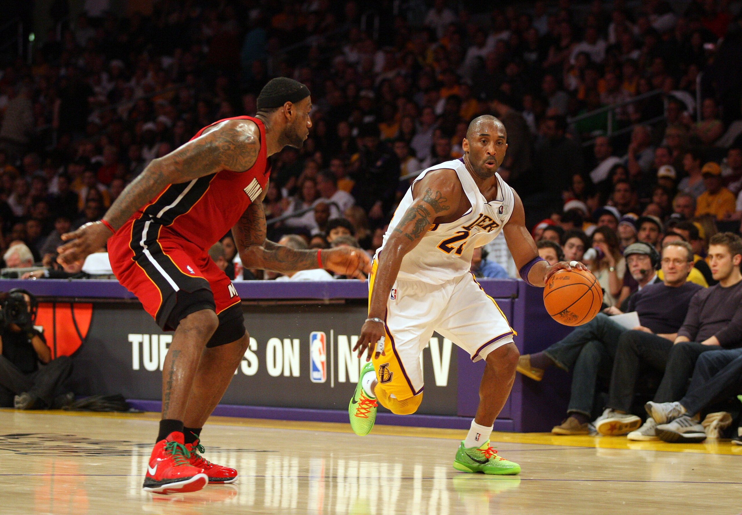 LOS ANGELES, CA - DECEMBER 25:  Kobe Bryant #24 of the Los Angeles Lakers dribbles the ball against LeBron James #6 of the Miami Heat during the NBA game at Staples Center on December 25, 2010 in Los Angeles, California. The Heat defeated the Lakers 96-80