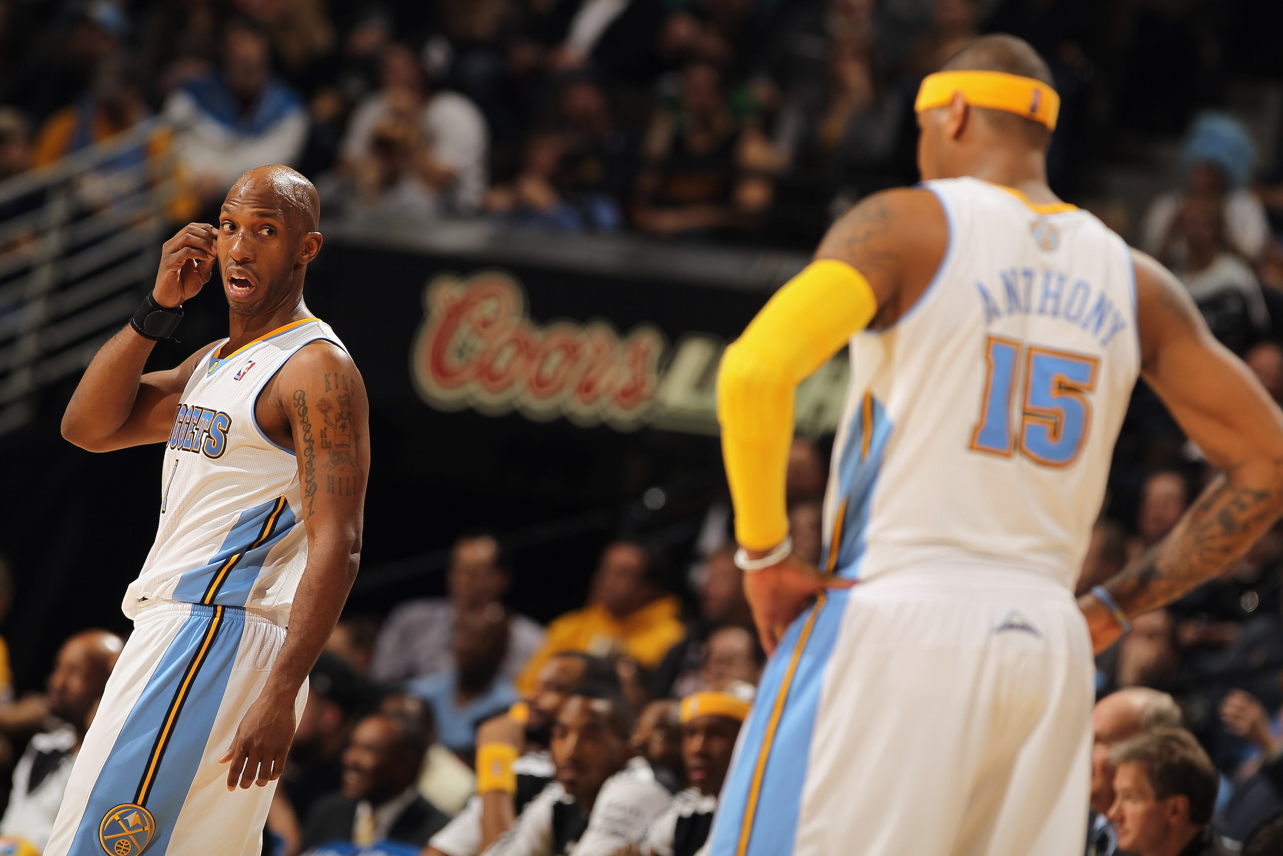 DENVER, CO - JANUARY 13:  Chauncey Billups #1 and Carmelo Anthony #15 of the Denver Nuggets look on during a break in the action against the Miami Heat at the Pepsi Center on January 13, 2011 in Denver, Colorado. The Nuggets defeated the Heat 130-102. NOT