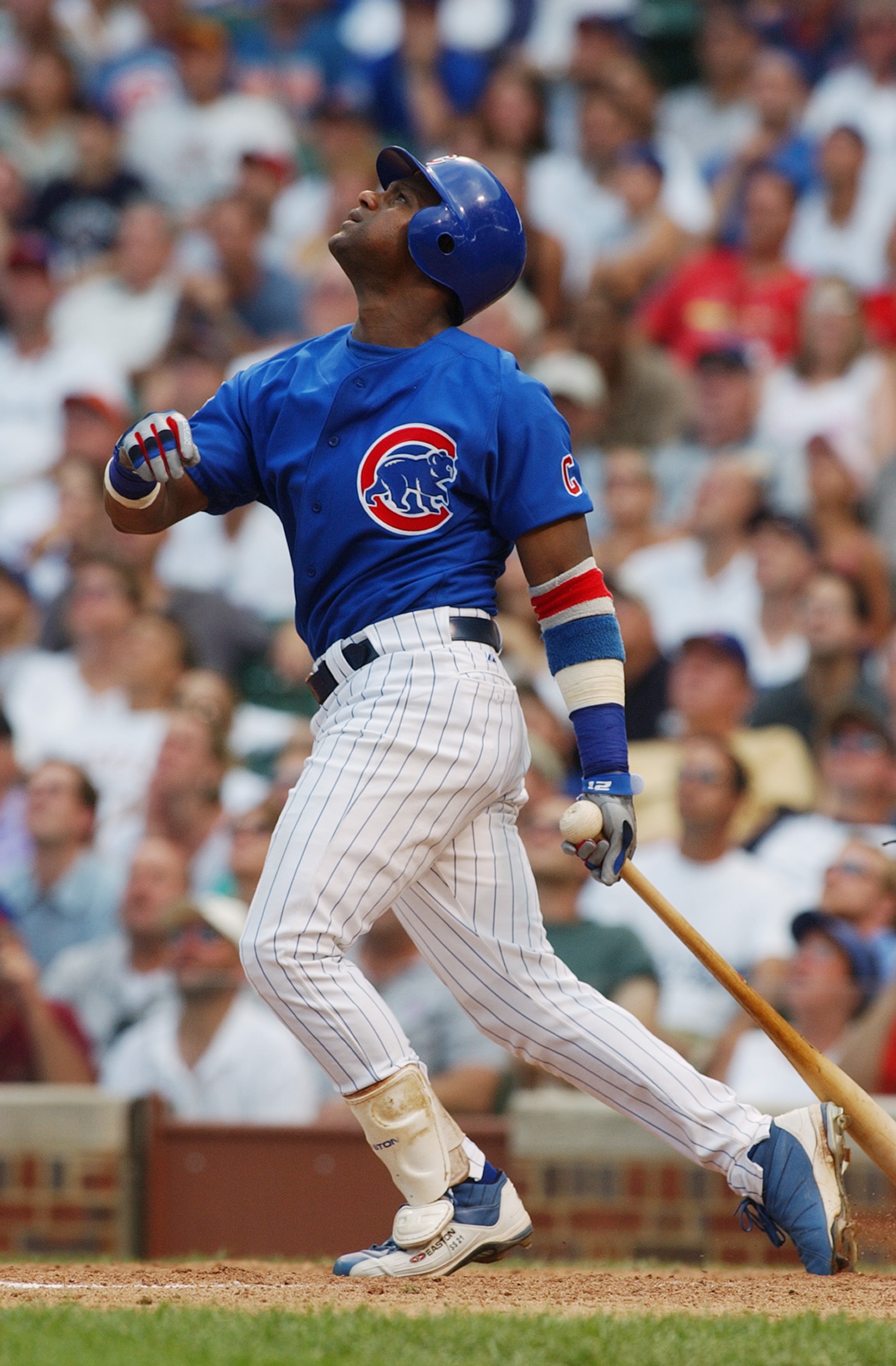 CHICAGO - JULY 20:  Sammy Sosa #21 of the Chicago Cubs watches the flight of the ball as he follows through on a swing during the game against the St. Louis Cardinals at Wrigley Field on July 20, 2004 in Chicago, Illinois. The Cardinals defeated the Cubs