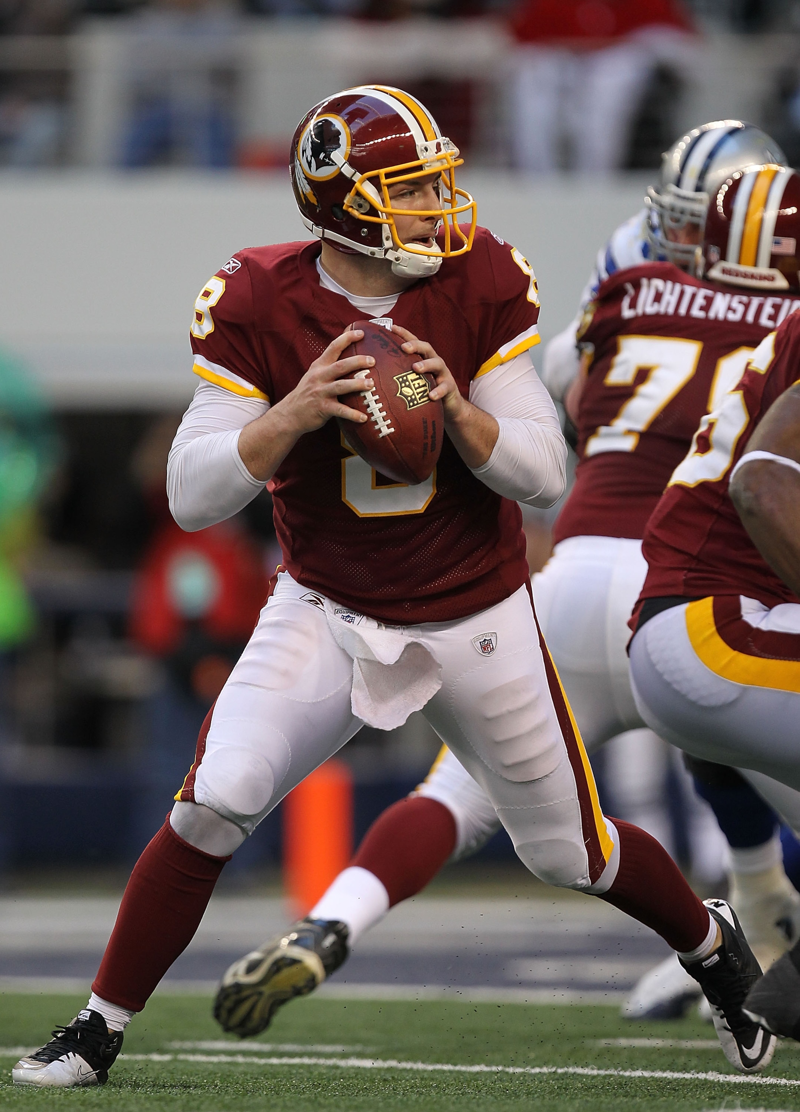 ARLINGTON, TX - DECEMBER 19:  Quarterback Rex Grossman #8 of the Washington Redskins passes against the Dallas Cowboys at Cowboys Stadium on December 19, 2010 in Arlington, Texas.  (Photo by Ronald Martinez/Getty Images)