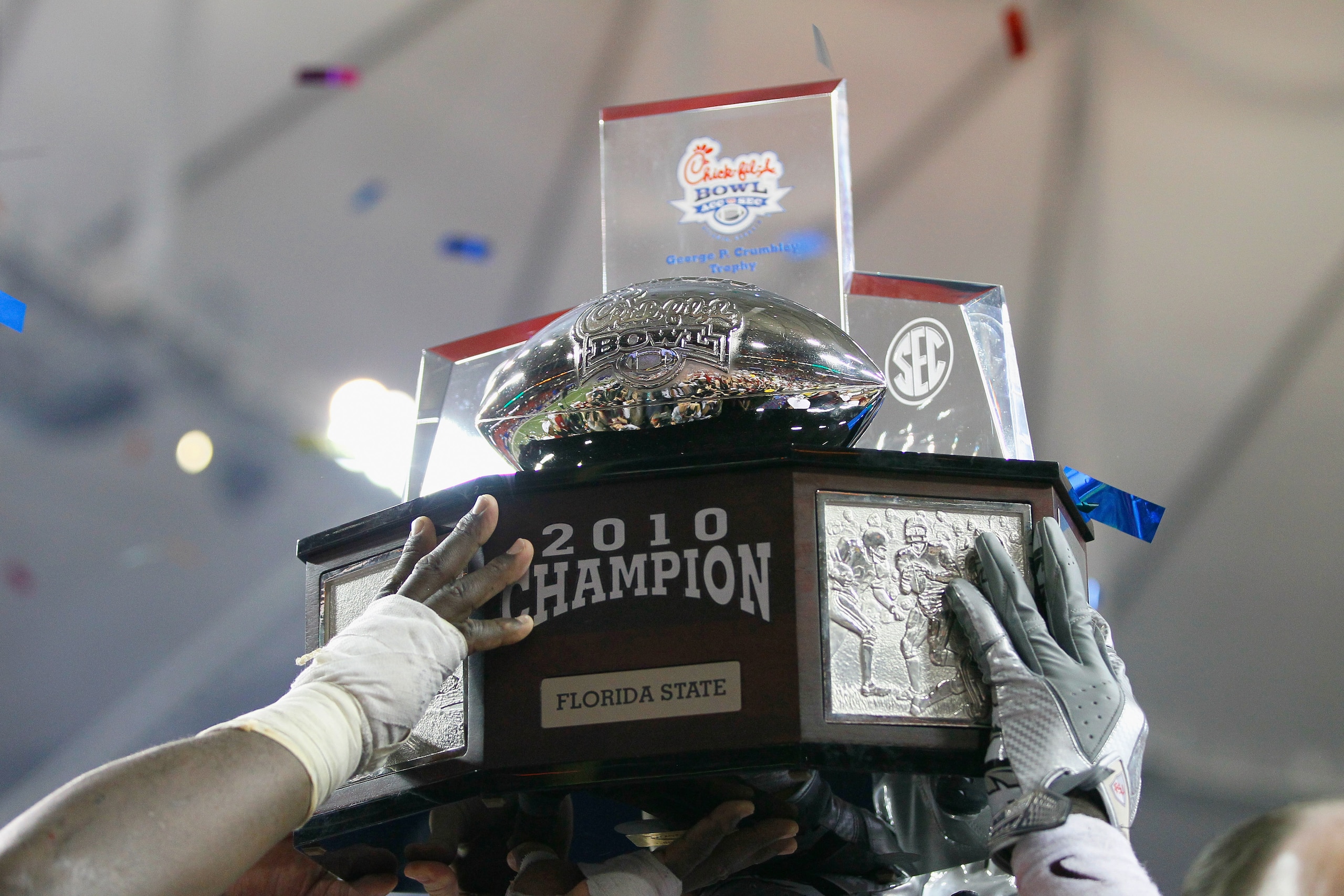 ATLANTA, GA - DECEMBER 31: The Florida State Seminoles hold up the trophy after their 26-17 win over the South Carolina Gamecocks during the 2010 Chick-fil-A Bowl at Georgia Dome on December 31, 2010 in Atlanta, Georgia. (Photo by Kevin C. Cox/Getty Ima ATLANTA, GA - DECEMBER 31: The Florida State Seminoles hold up the trophy after their 26-17 win over the South Carolina Gamecocks during the 2010 Chick-fil-A Bowl at Georgia Dome on December 31, 2010 in Atlanta, Georgia. (Photo by Kevin C. Cox/Getty Ima