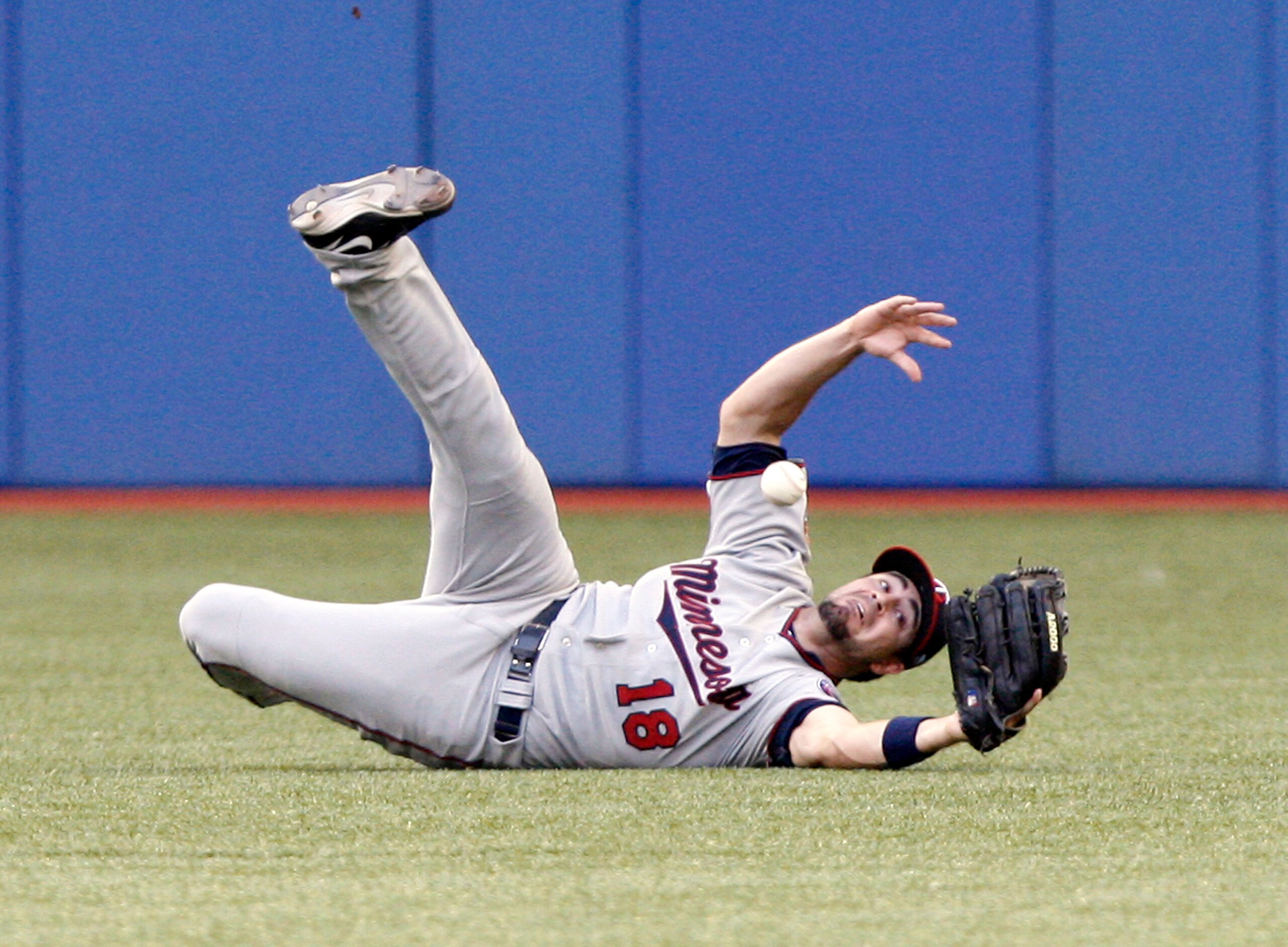 TORONTO - JULY 8: Jason Repko #18 of the Minnesota Twins misses a Jose Molina fly ball during a MLB game against the Toronto Blue Jays at The Rogers Centre July 8, 2010 in Toronto, Ontario, Canada. (Photo by Abelimages/Getty Images)