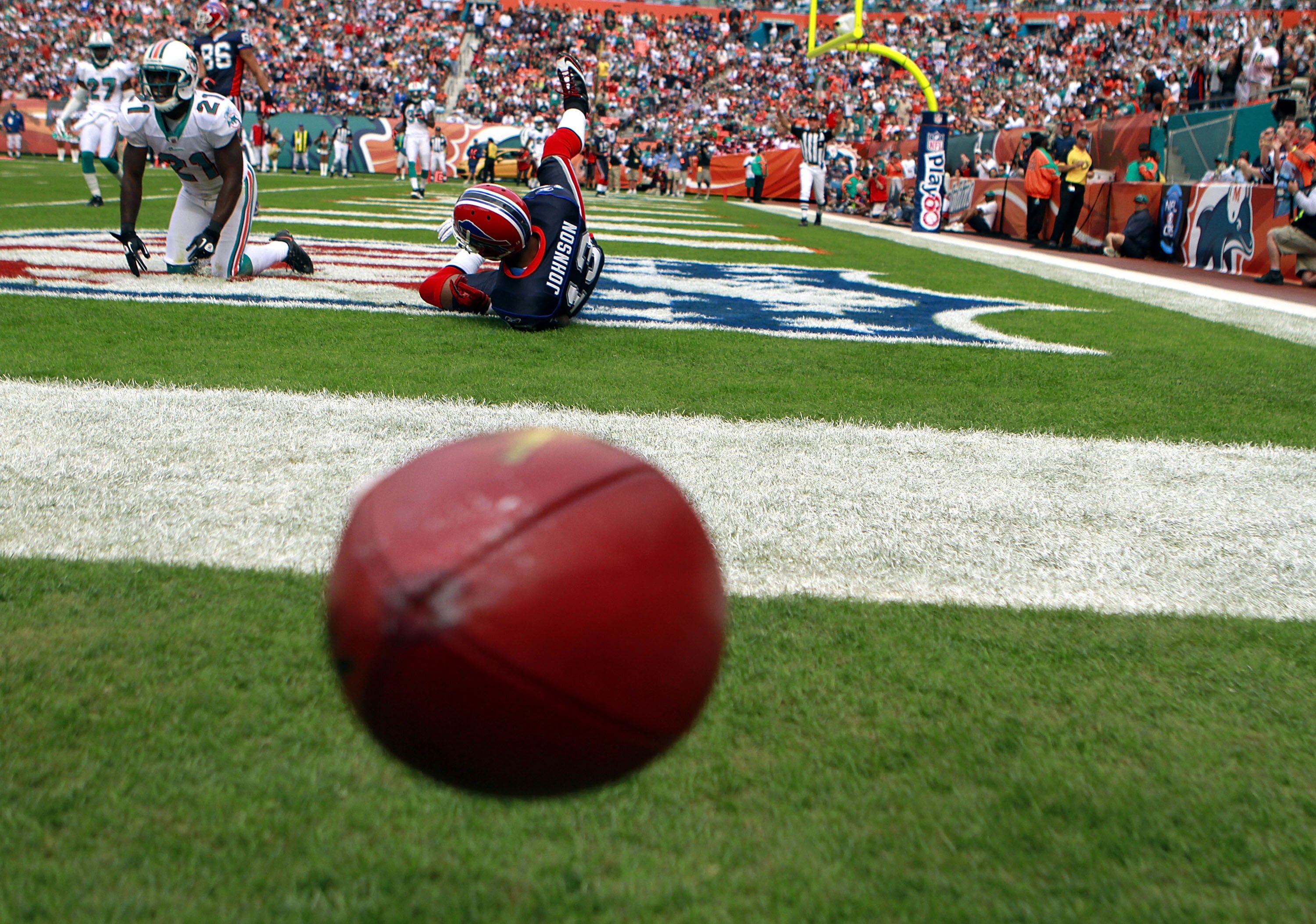 MIAMI - DECEMBER 19:  Defensive back Vontae Davis #21 of the Miami Dolphins breaks up a catch against receiver Steve Johnson #13 of the Buffalo Bills at Sun Life Stadium on December 19, 2010 in Miami, Florida. The Bills defeated the Dolphins 17-14.  (Phot