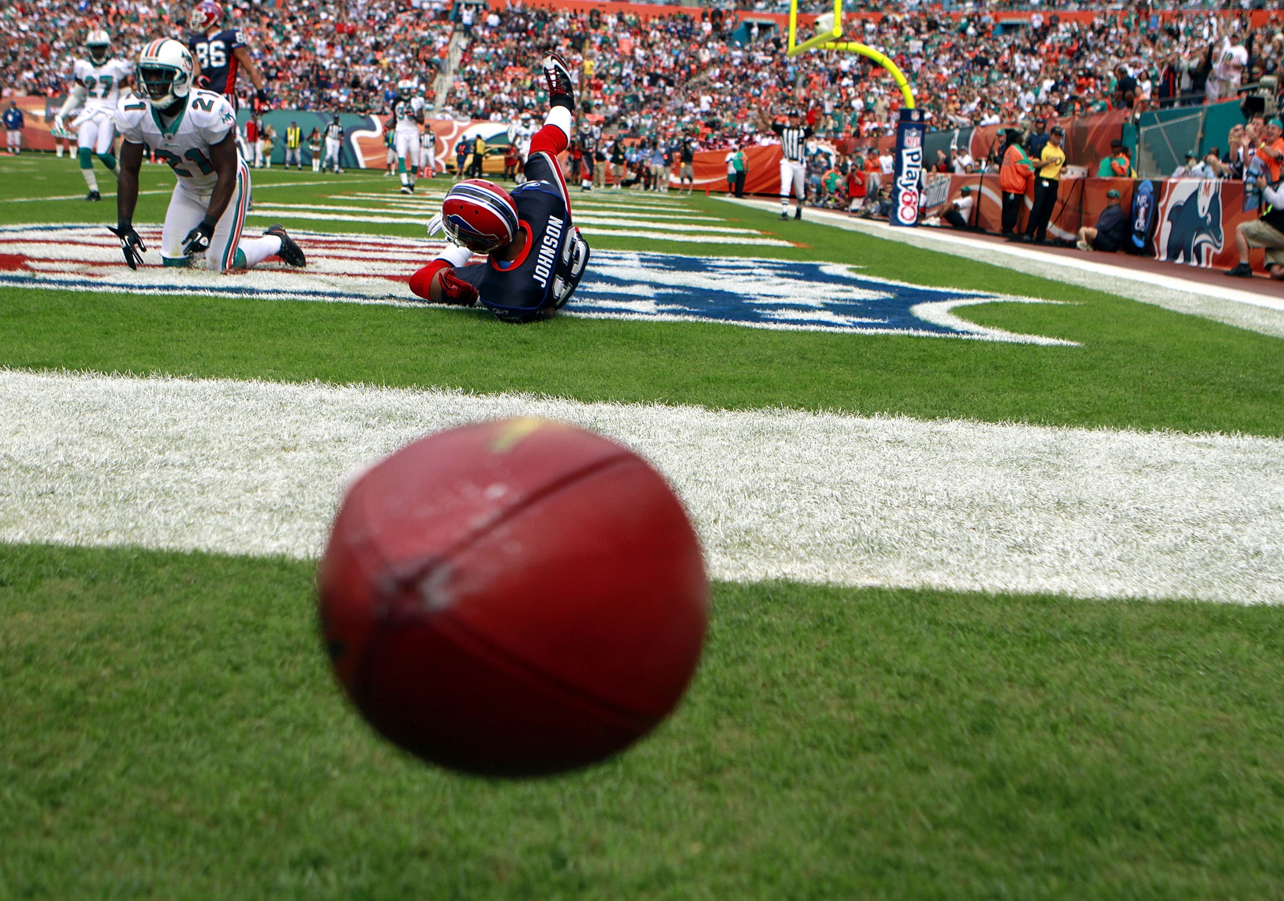 MIAMI - DECEMBER 19:  Defensive back Vontae Davis #21 of the Miami Dolphins breaks up a catch against receiver Steve Johnson #13 of the Buffalo Bills at Sun Life Stadium on December 19, 2010 in Miami, Florida. The Bills defeated the Dolphins 17-14.  (Phot