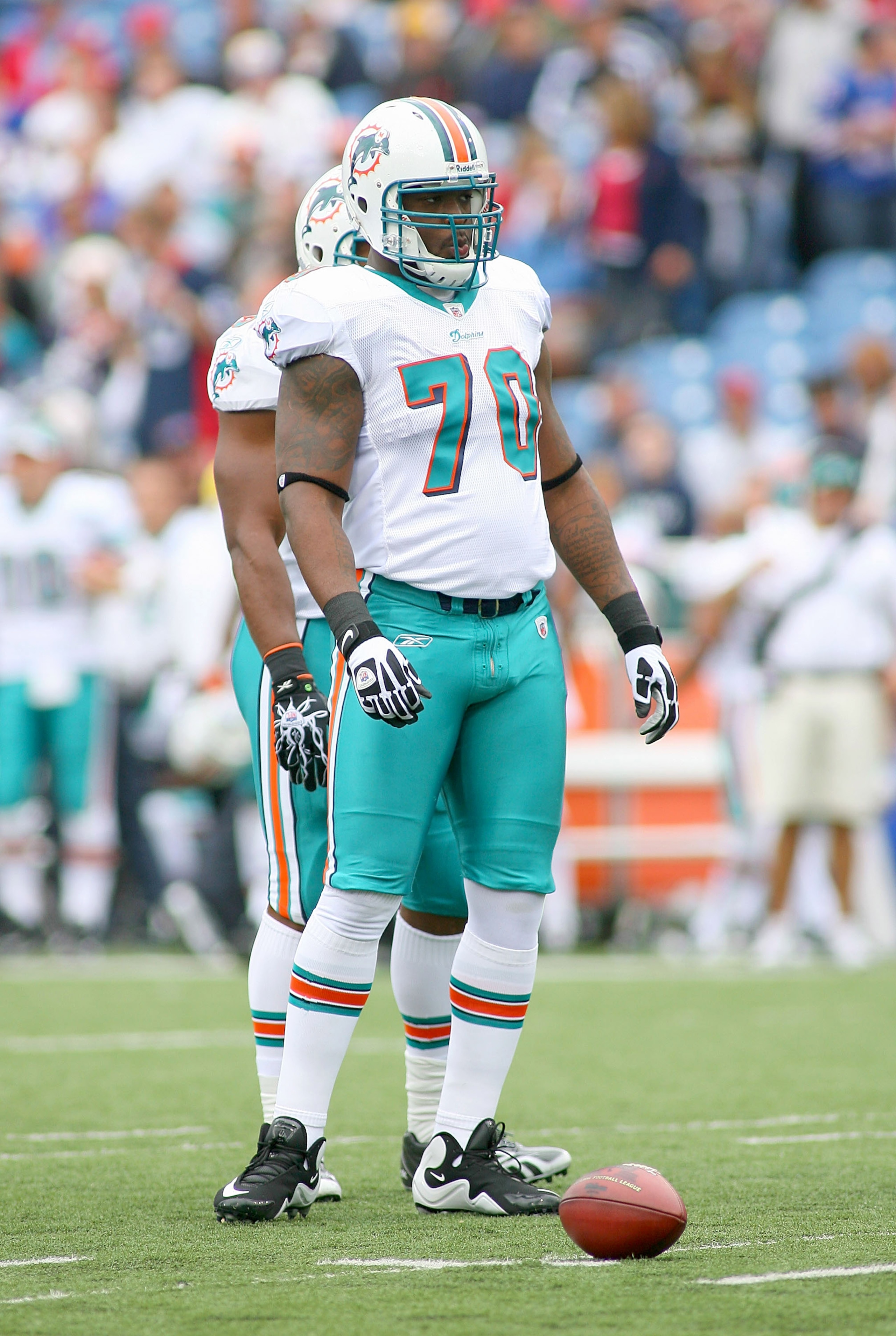 ORCHARD PARK, NY - SEPTEMBER 12: Kendall Langford #70 of the Miami Dolphins stands on the field during the NFL season opener against the Buffalo Bills at Ralph Wilson Stadium on September 12, 2010 in Orchard Park, New York. The Dolphins won 15-10. (Photo