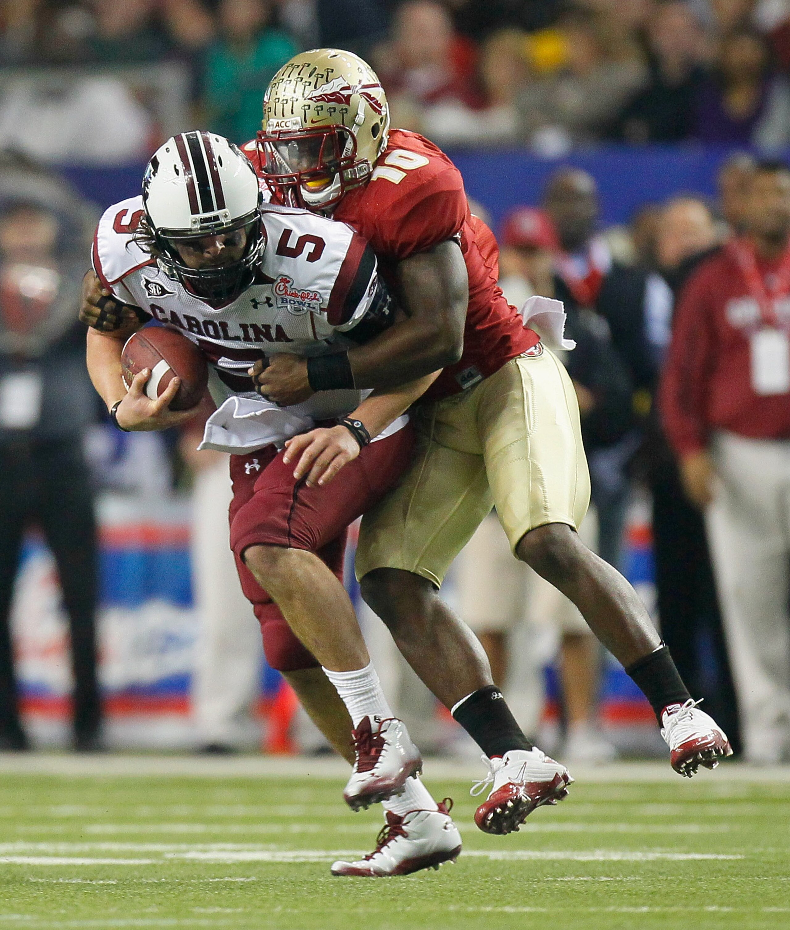 ATLANTA, GA - DECEMBER 31: Nick Moody #10 of the Florida State Seminoles tackles quarterback Stephen Garcia #5 of the South Carolina Gamecocks during the 2010 Chick-fil-A Bowl at Georgia Dome on December 31, 2010 in Atlanta, Georgia. (Photo by Kevin C. ATLANTA, GA - DECEMBER 31: Nick Moody #10 of the Florida State Seminoles tackles quarterback Stephen Garcia #5 of the South Carolina Gamecocks during the 2010 Chick-fil-A Bowl at Georgia Dome on December 31, 2010 in Atlanta, Georgia. (Photo by Kevin C.