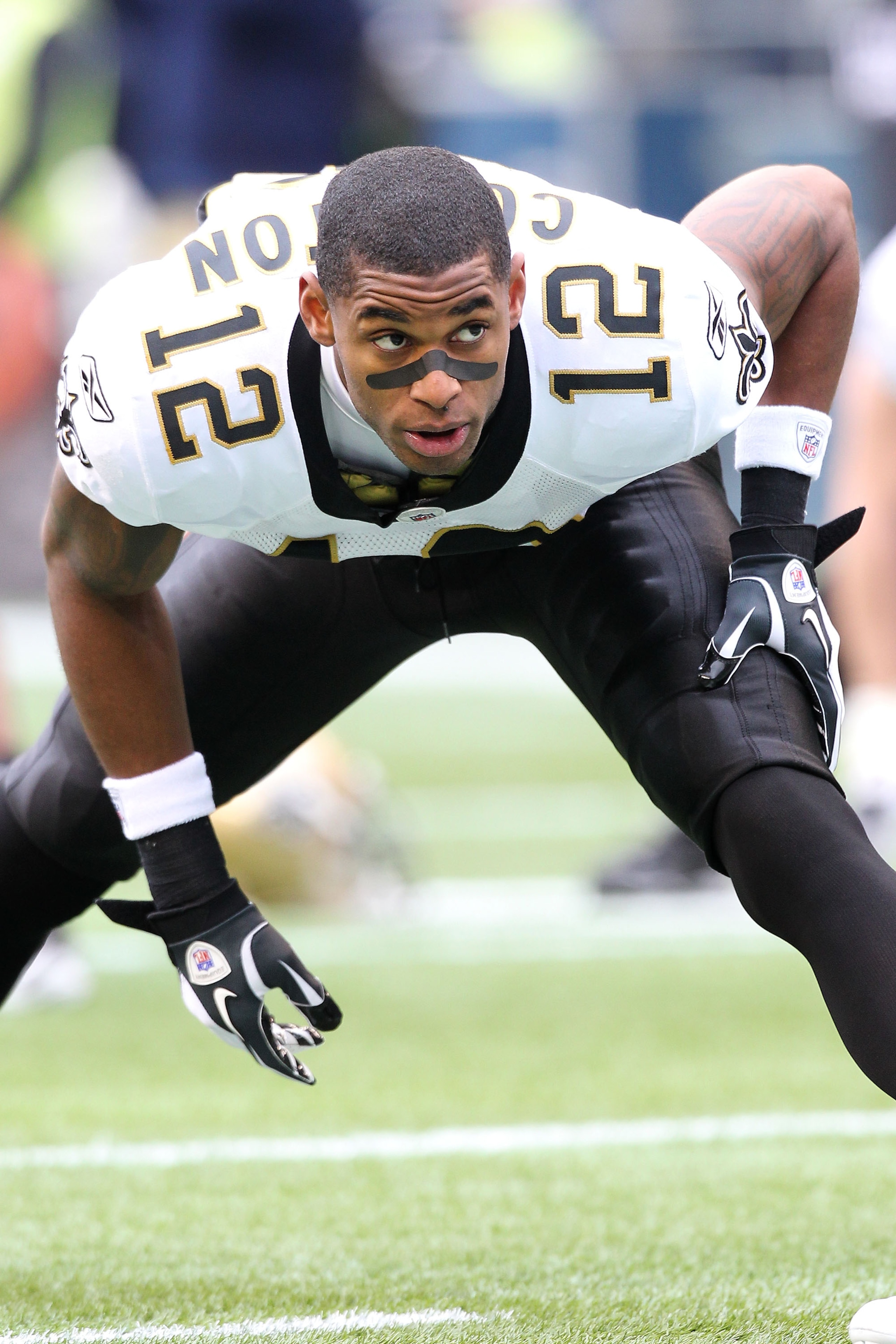 SEATTLE, WA - JANUARY 08:  Marques Colston #12 of the New Orleans Saints stretches before their game against the Seattle Seahawks during the 2011 NFC wild-card playoff game at Qwest Field on January 8, 2011 in Seattle, Washington.  (Photo by Otto Greule J
