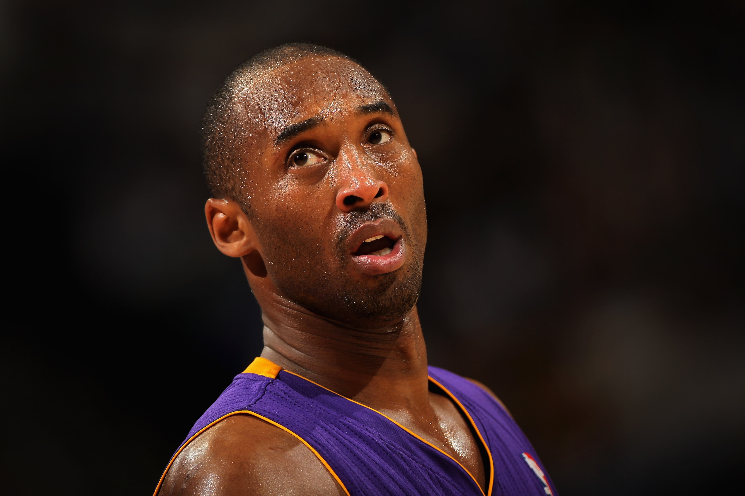 DENVER, CO - JANUARY 21: Kobe Bryant #24 of the Los Angeles Lakers looks on during a break in the action against the Denver Nuggets at the Pepsi Center on January 21, 2011 in Denver, Colorado. The Lakers defeated the Nuggets 97-107. NOTE TO USER: User ex DENVER, CO - JANUARY 21: Kobe Bryant #24 of the Los Angeles Lakers looks on during a break in the action against the Denver Nuggets at the Pepsi Center on January 21, 2011 in Denver, Colorado. The Lakers defeated the Nuggets 97-107. NOTE TO USER: User ex