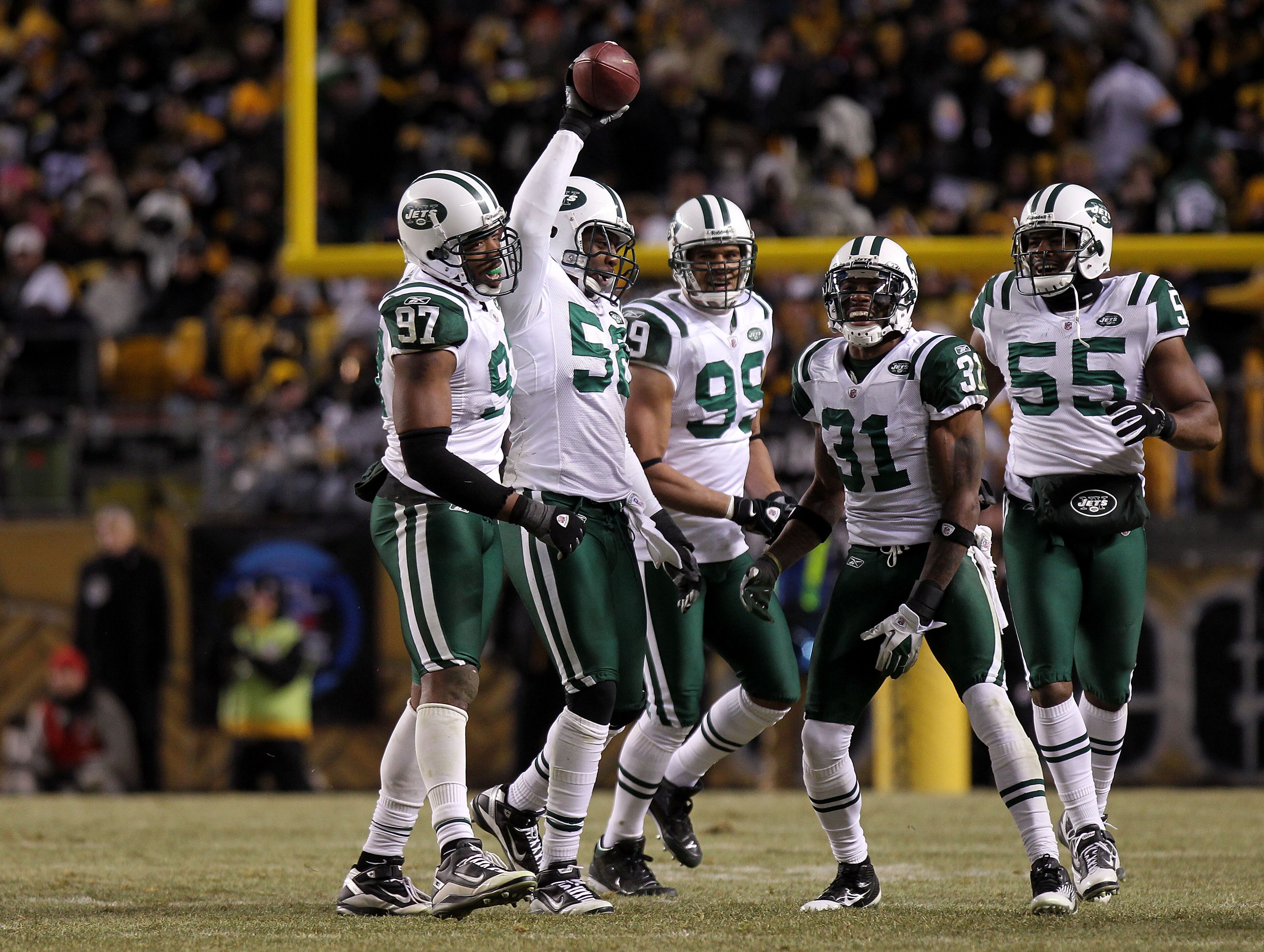 PITTSBURGH, PA - JANUARY 23: (L-R) Calvin Pace #97, Bryan Thomas #58, Jason Taylor #99, Antonio Cromartie #31 and Jamaal Westerman #55 of the New York Jets celebrate after an interception by Thomas against the Pittsburgh Steelers during the 2011 AFC Cham PITTSBURGH, PA - JANUARY 23: (L-R) Calvin Pace #97, Bryan Thomas #58, Jason Taylor #99, Antonio Cromartie #31 and Jamaal Westerman #55 of the New York Jets celebrate after an interception by Thomas against the Pittsburgh Steelers during the 2011 AFC Cham