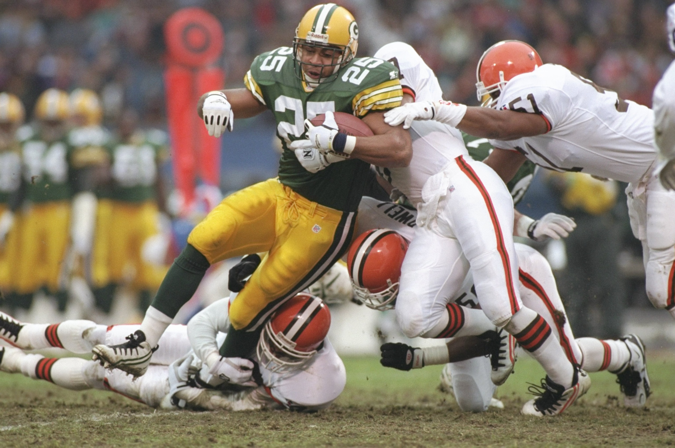 19 Nov 1995: Running back Dorsey Levens of the Green Bay Packers gets tackled by Cleveland Browns defensive back Stevon Moore during a game at Cleveland Stadium in Cleveland, Ohio. The Packers won the game, 31-20.