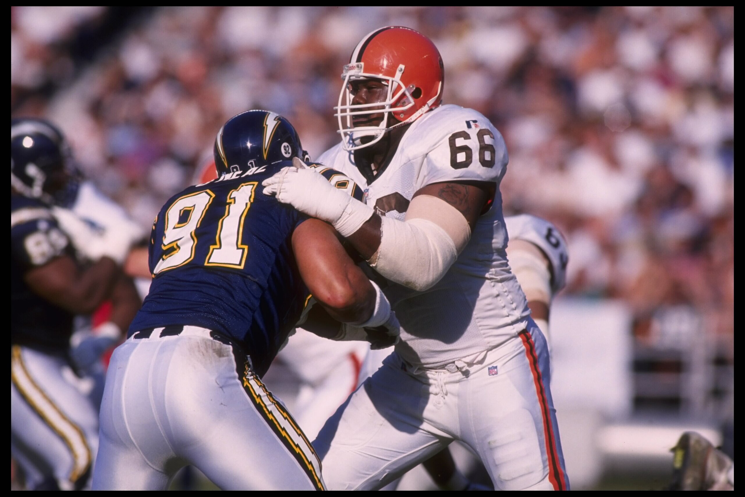3 Dec 1995:  Tackle Tony Jones #66 of the Cleveland Browns tries to keep defensive end Leslie O'Neal #91 of the San Diego Chargers far away from his quarterback at Jack Murphy Stadium in San Diego, California.  The Chargers defeated the Browns 31-13.  Man