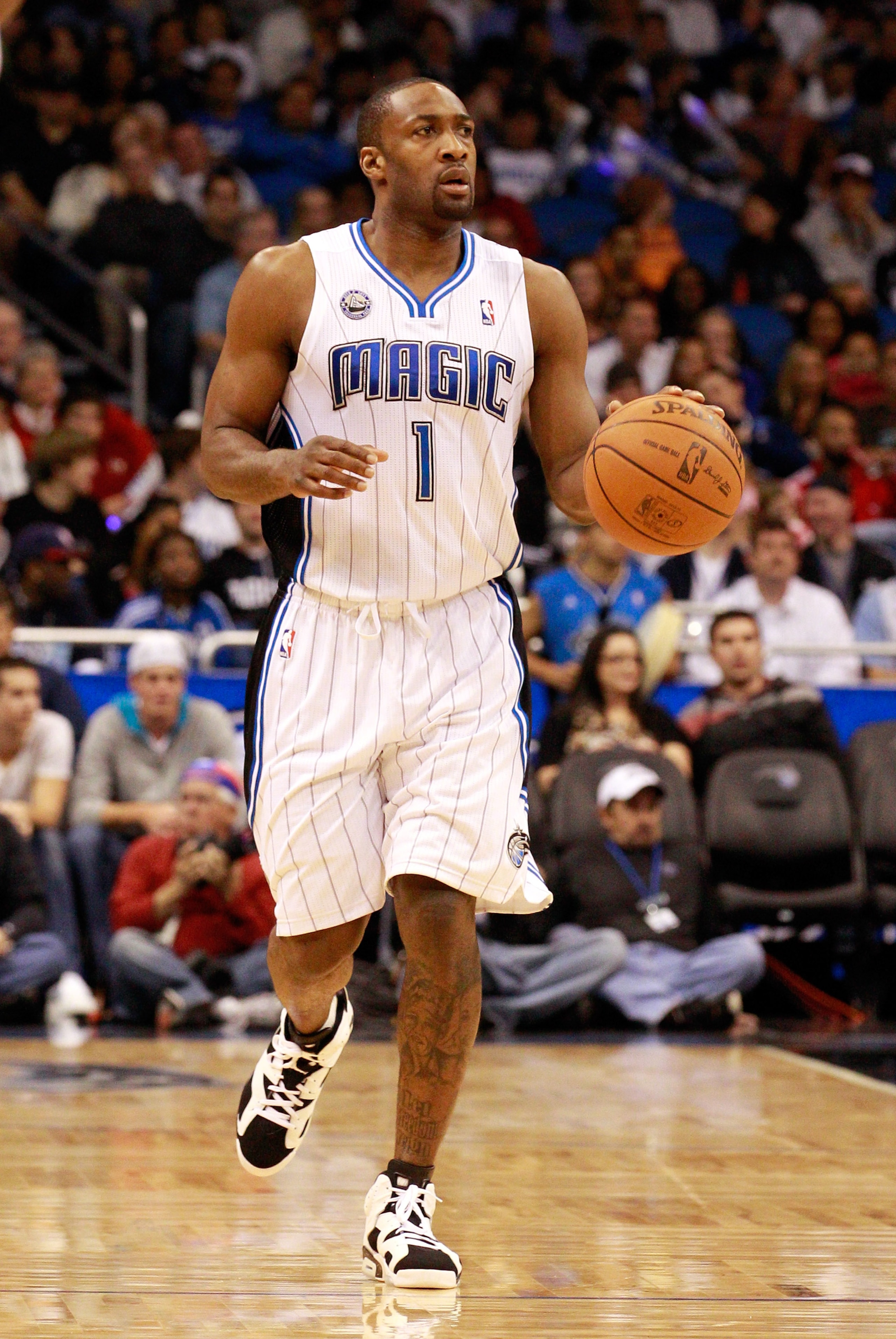 ORLANDO, FL - JANUARY 24: Gilbert Arenas #1 of the Orlando Magic sets up a play during the game against the Detroit Pistons at Amway Arena on January 24, 2011 in Orlando, Florida. NOTE TO USER: User expressly acknowledges and agrees that, by downloading ORLANDO, FL - JANUARY 24: Gilbert Arenas #1 of the Orlando Magic sets up a play during the game against the Detroit Pistons at Amway Arena on January 24, 2011 in Orlando, Florida. NOTE TO USER: User expressly acknowledges and agrees that, by downloading