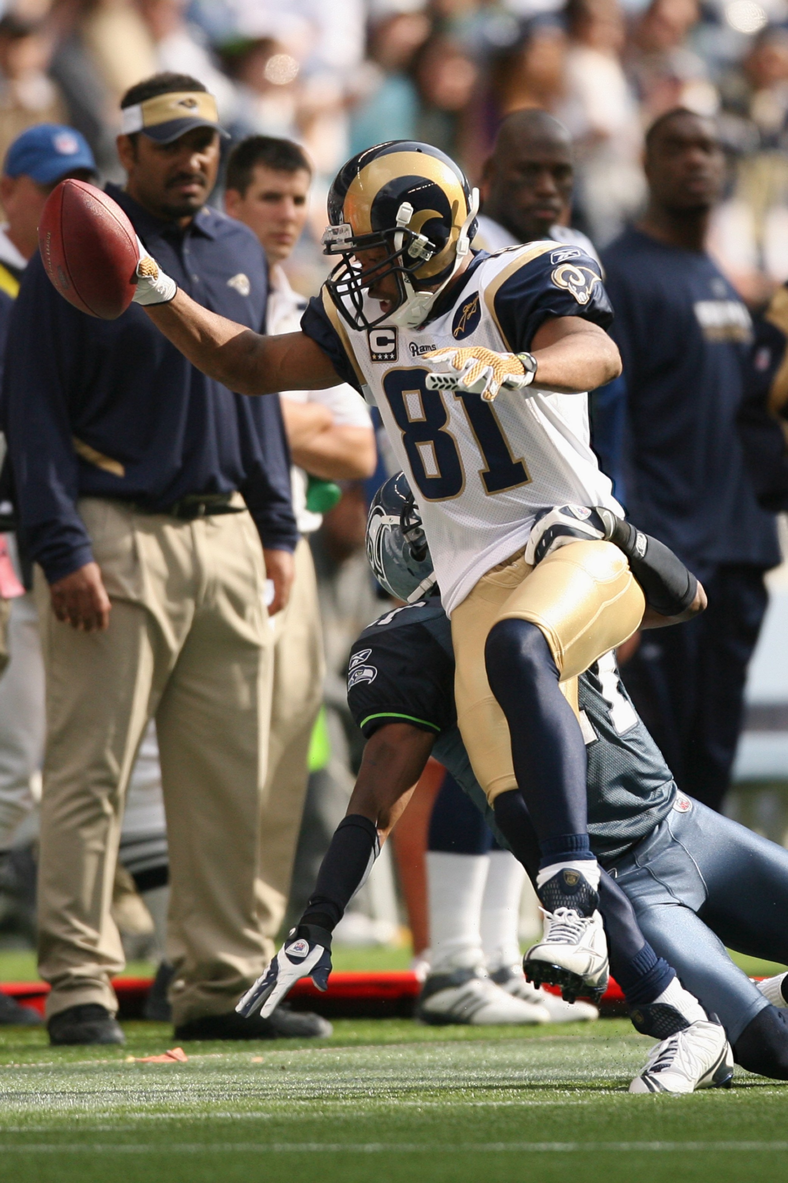 SEATTLE - SEPTEMBER 21:  Torry Holt #81 of the St. Louis Rams catches a pass during the game against the Seattle Seahawks on September 21, 2008 at Qwest Field in Seattle, Washington. (Photo by Otto Greule Jr/Getty Images)