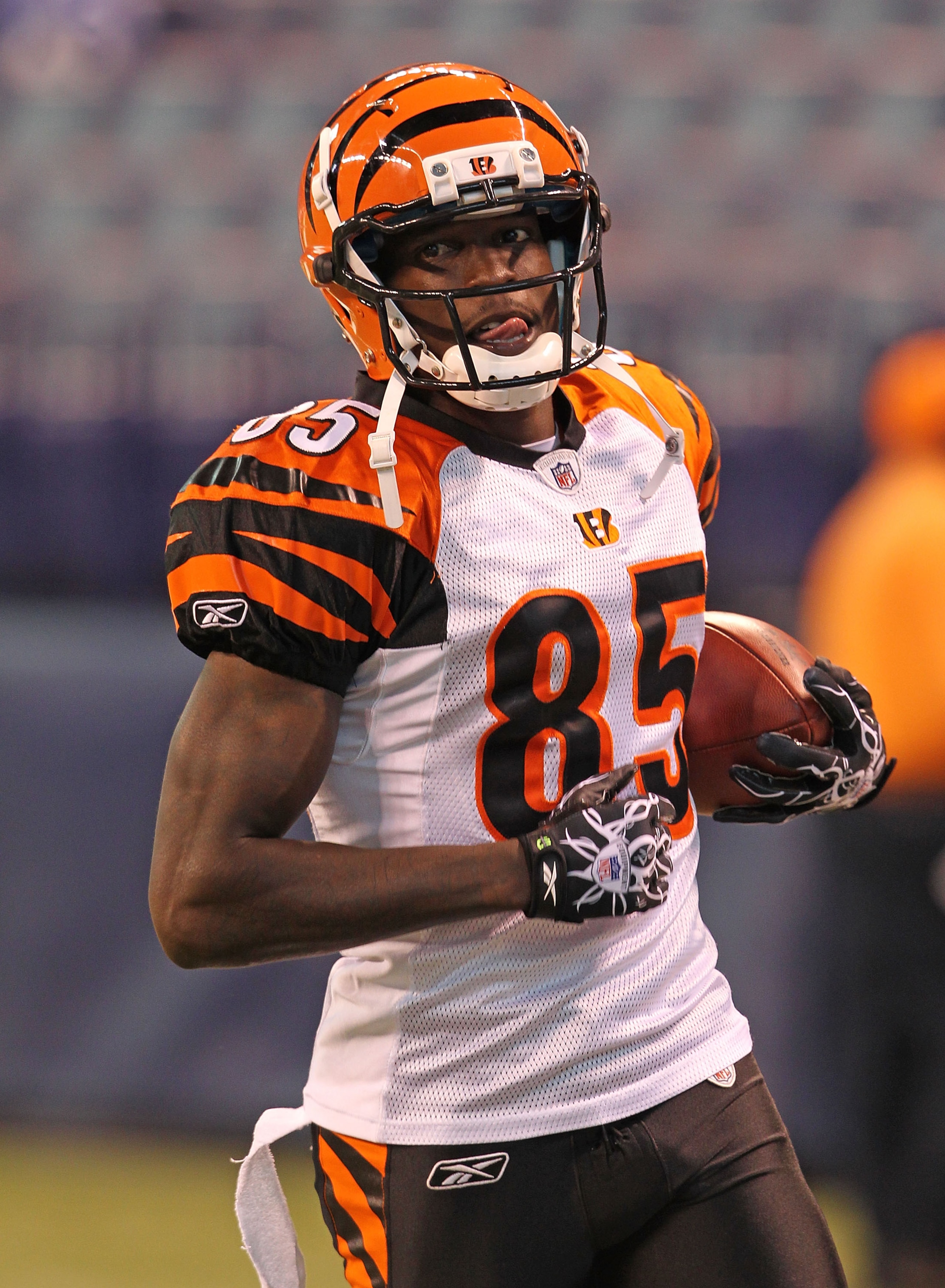 INDIANAPOLIS - SEPTEMBER 02:  Chad Ochocinco #85 of the Cincinnati Bengals runs with the ball before the NFL preseason game against the Indianapolis Colts at Lucas Oil Stadium on September 2, 2010 in Indianapolis, Indiana.  (Photo by Andy Lyons/Getty Imag