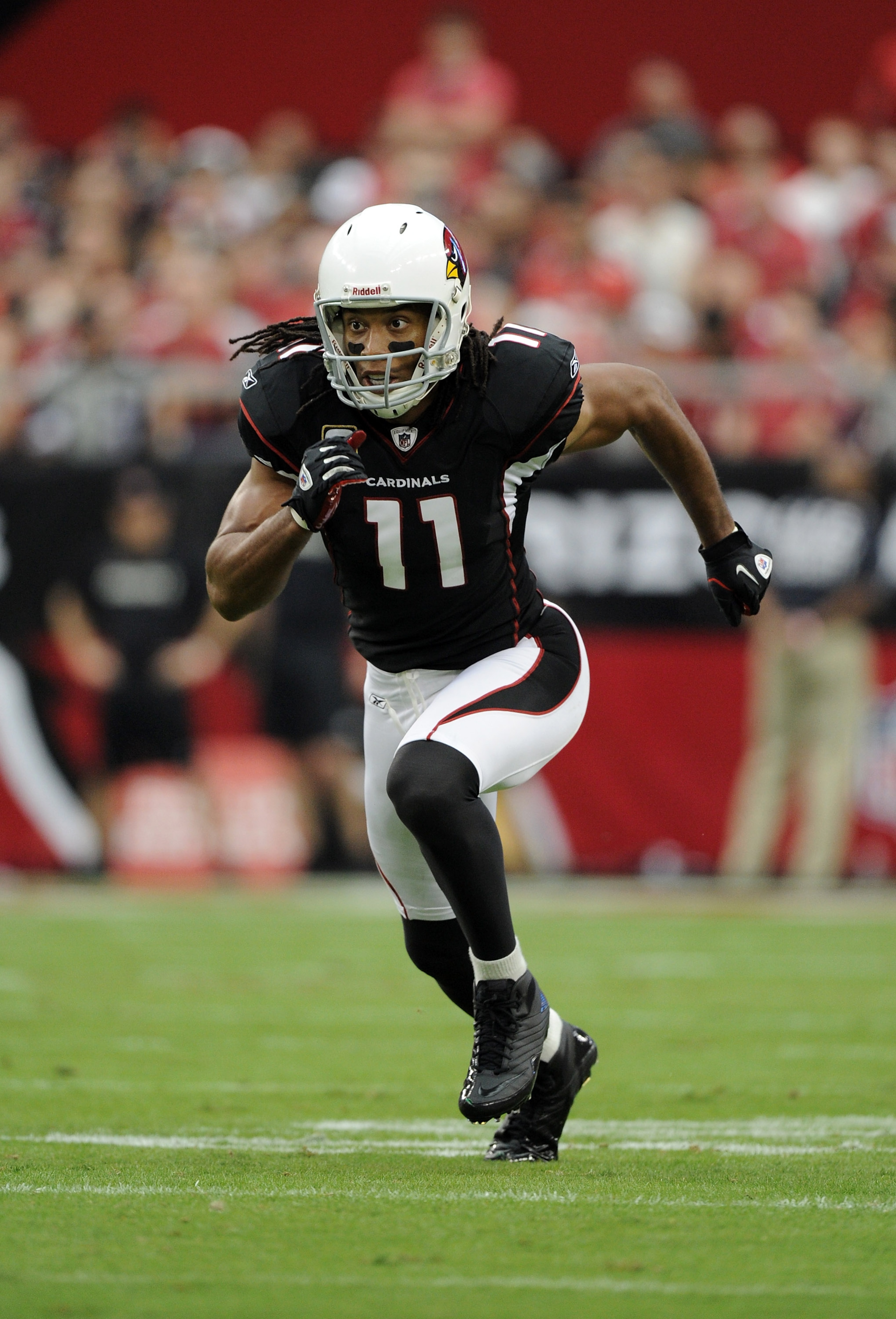 GLENDALE, AZ - OCTOBER 31: Larry Fitzgerald #11 of the Arizona Cardinals comes off the line of scrimmage against the Tampa Bay Buccaneers at University of Phoenix Stadium on October 31, 2010 in Glendale, Arizona. (Photo by Harry How/Getty Images) GLENDALE, AZ - OCTOBER 31: Larry Fitzgerald #11 of the Arizona Cardinals comes off the line of scrimmage against the Tampa Bay Buccaneers at University of Phoenix Stadium on October 31, 2010 in Glendale, Arizona. (Photo by Harry How/Getty Images)