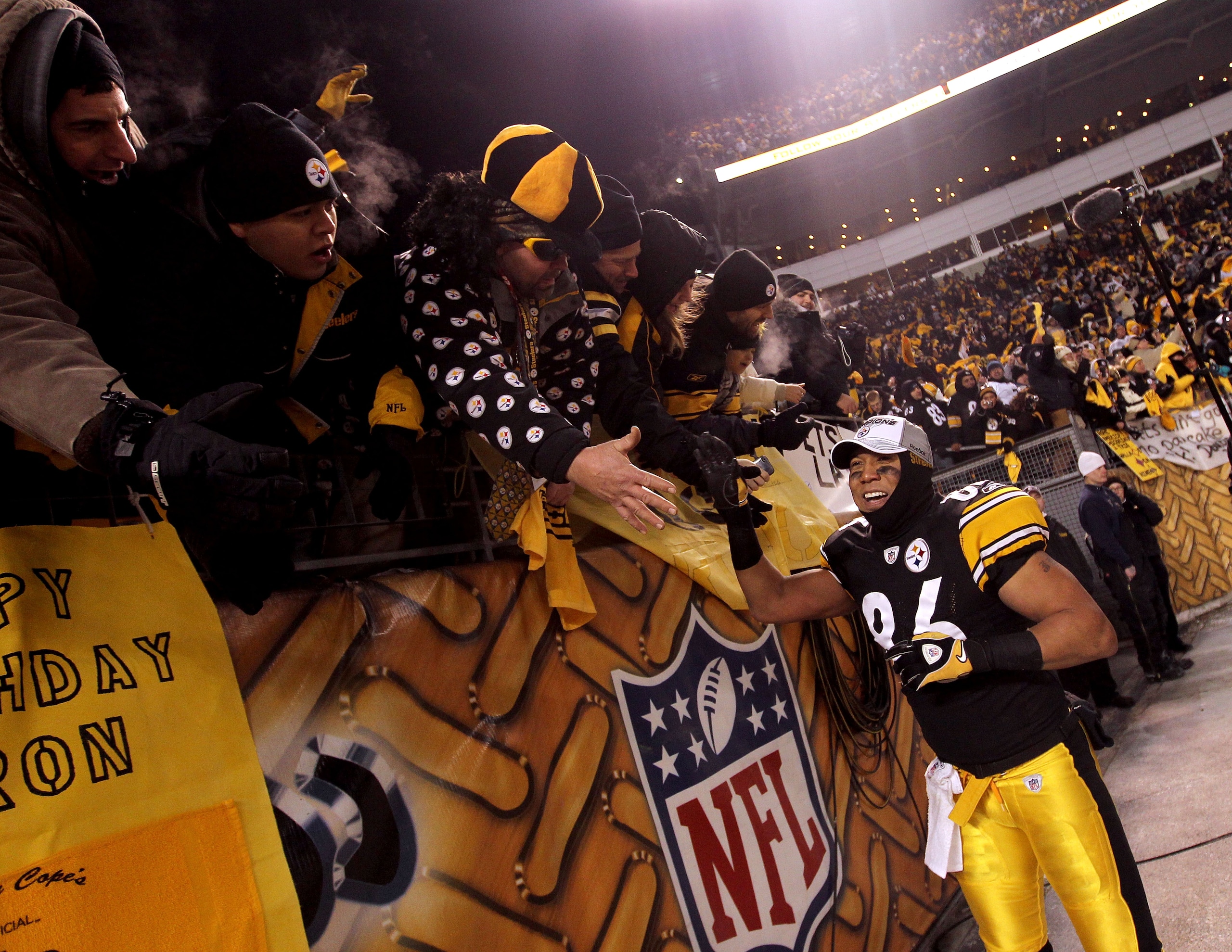 PITTSBURGH, PA - JANUARY 23:  Hines Ward #86 of the Pittsburgh Steelers celebrates with fans after their 24 to 19 win over the New York Jets in the 2011 AFC Championship game at Heinz Field on January 23, 2011 in Pittsburgh, Pennsylvania.  (Photo by Nick