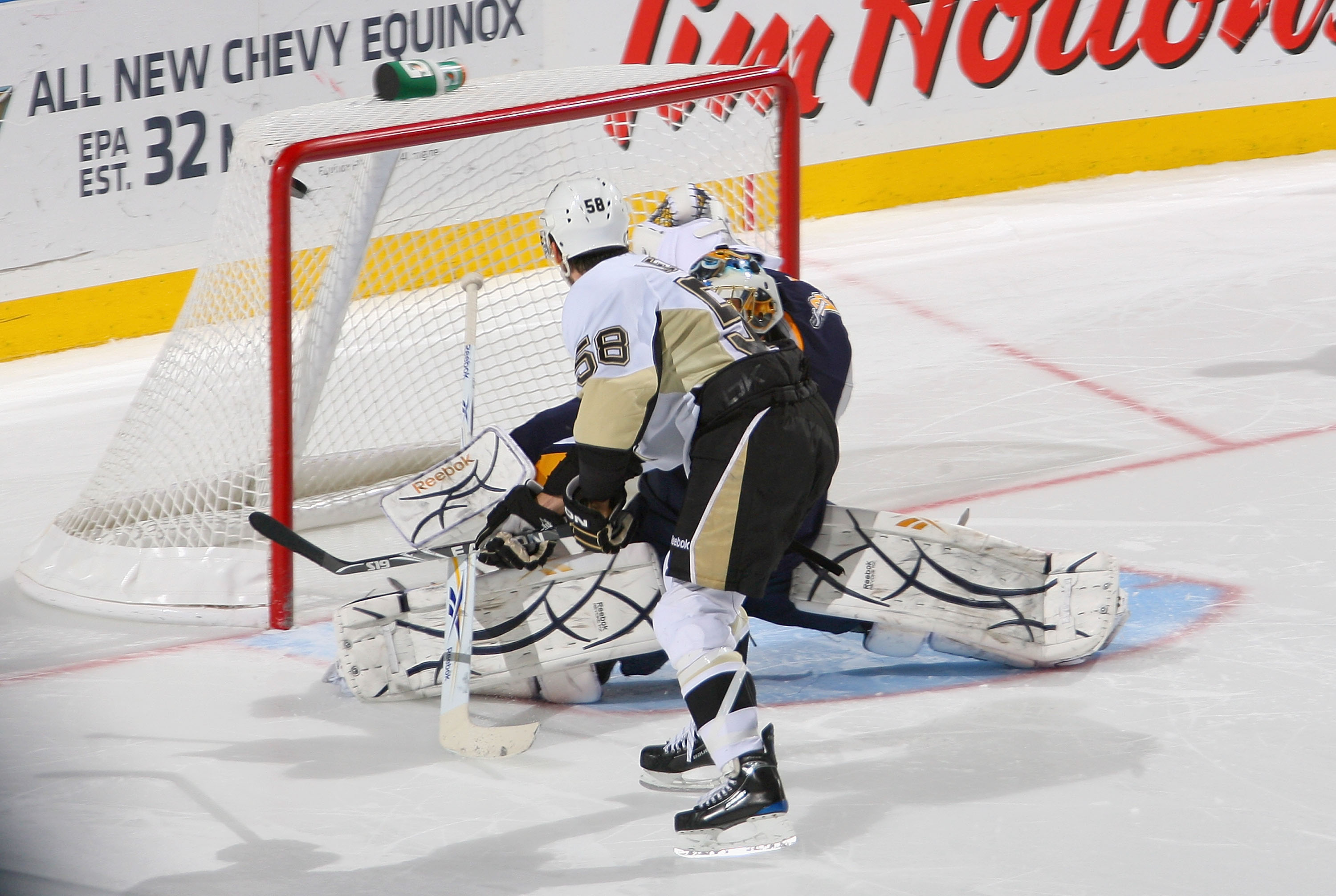 BUFFALO, NY - DECEMBER 19: Kris Letang #58 of the Pittsburgh Penguins scores the game winning goal in a shootout on Patrick Lalime #40 of the Buffalo Sabres  at HSBC Arena on December 19, 2009 in Buffalo, New York. Pittsburgh won 2-1. (Photo by Rick Stewa
