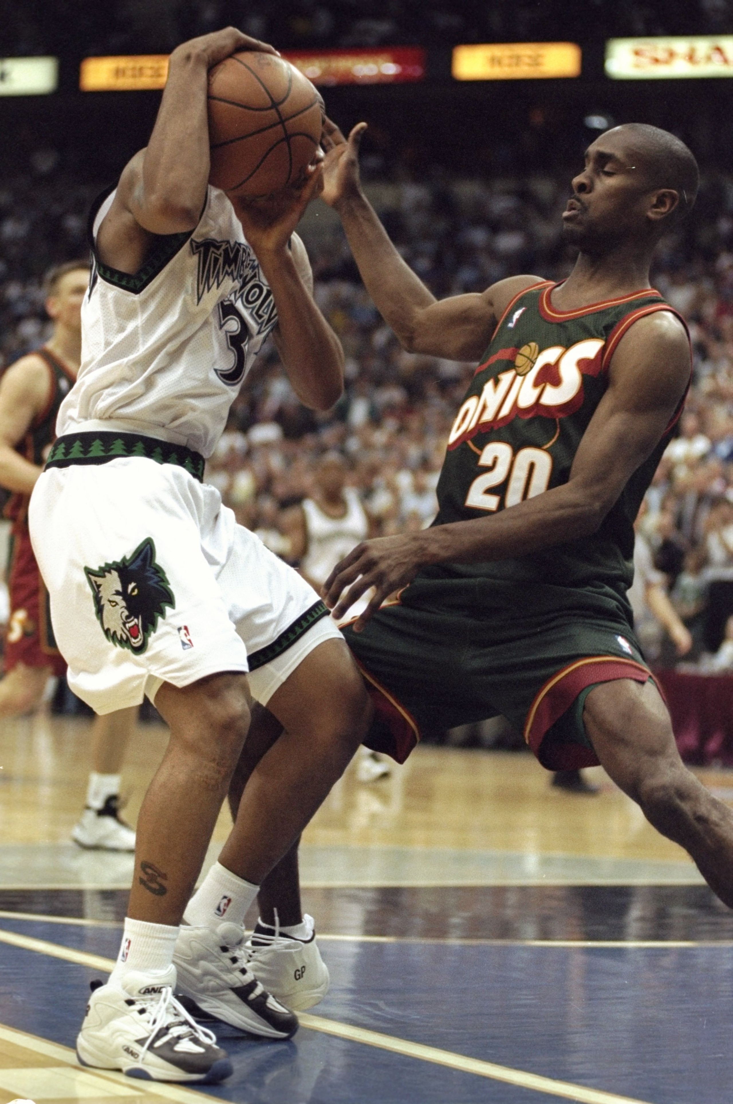 28 Apr 1998: Stephon Marbury #20 of the Minneapolis Timberwolves in action against Gary Payton #3 of the Seattle Super Sonics at the Target Center in Minneapolis, Minnesota. The Timberwolves defeated the Sonics 98-90.